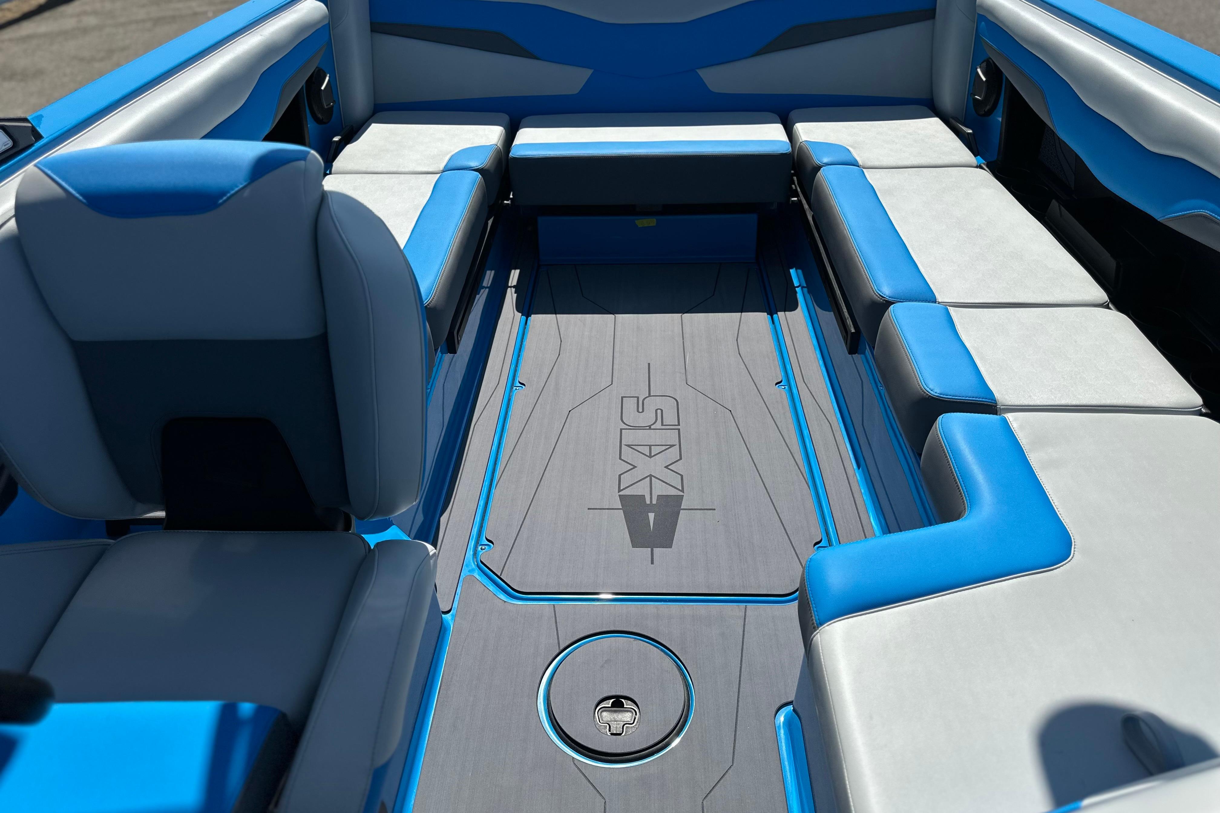 2026 Axis T235 boat interior with blue and gray seating, showcasing modern design.