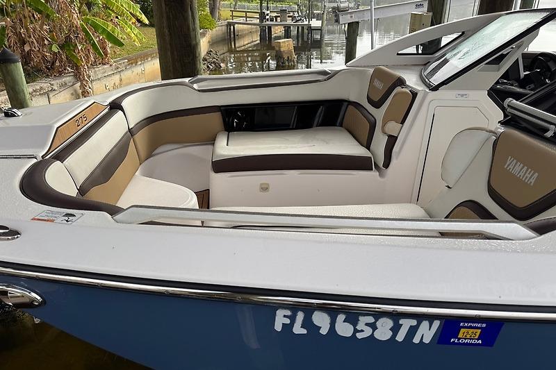 2023 Yamaha 275SDX boat interior with seating, docked in Florida.