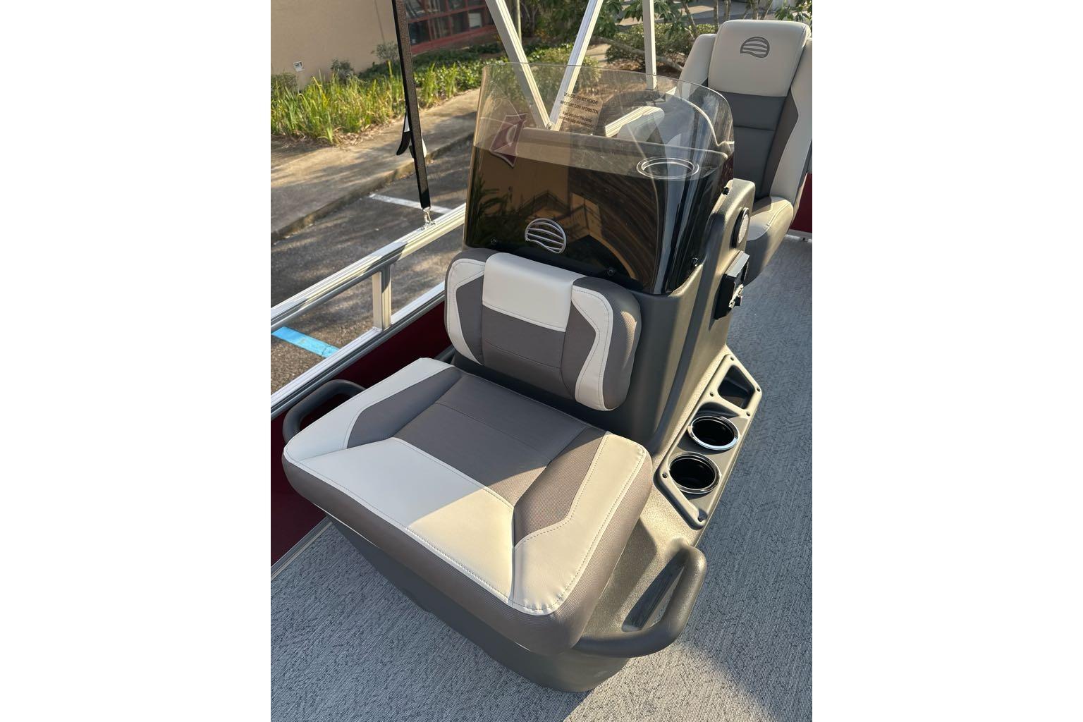 2026 Sun Tracker Bass Buggy 16 XL Select boat seats with cup holders and windshield.