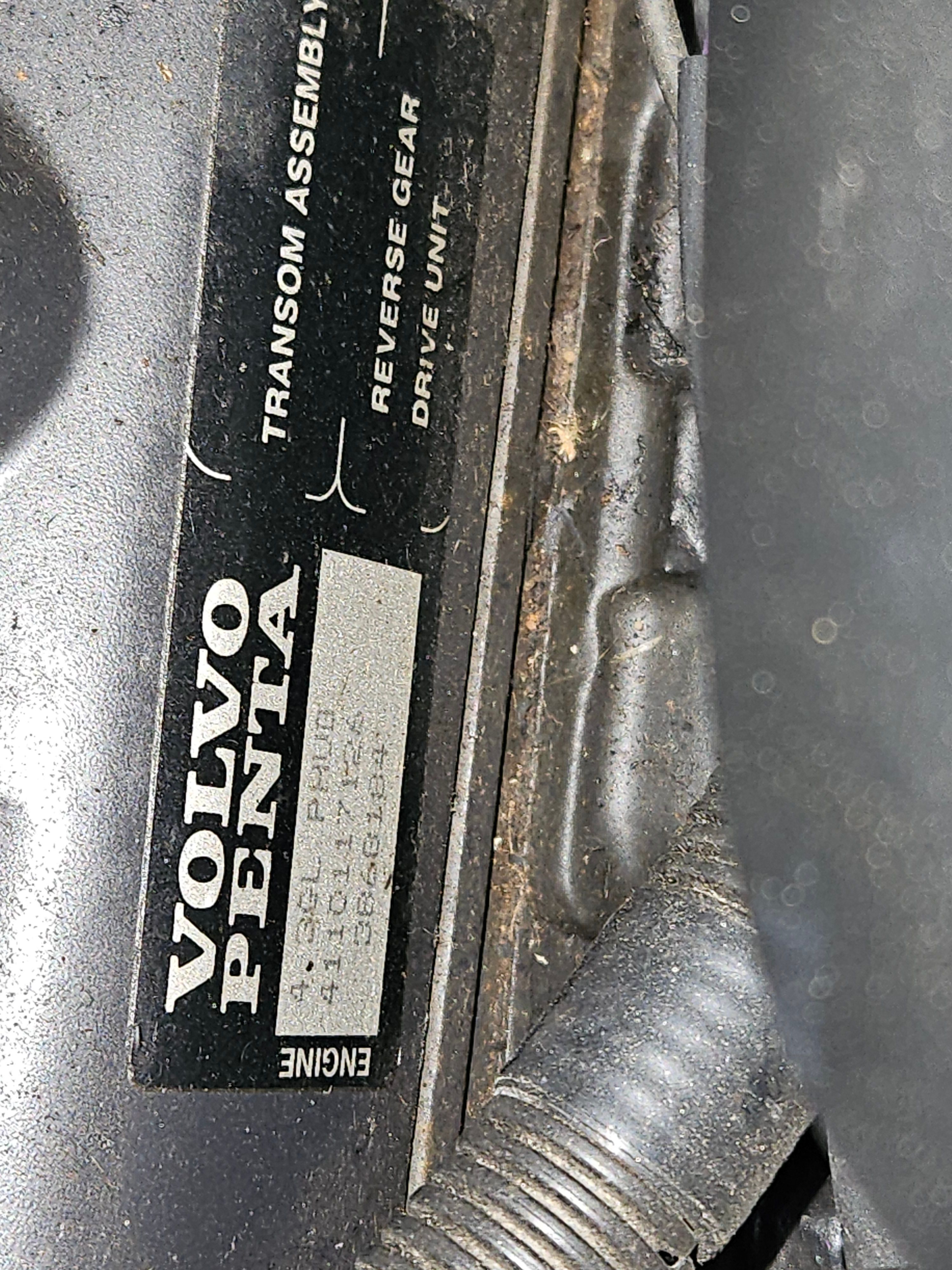 Close-up of a Volvo Penta engine part with labeling.