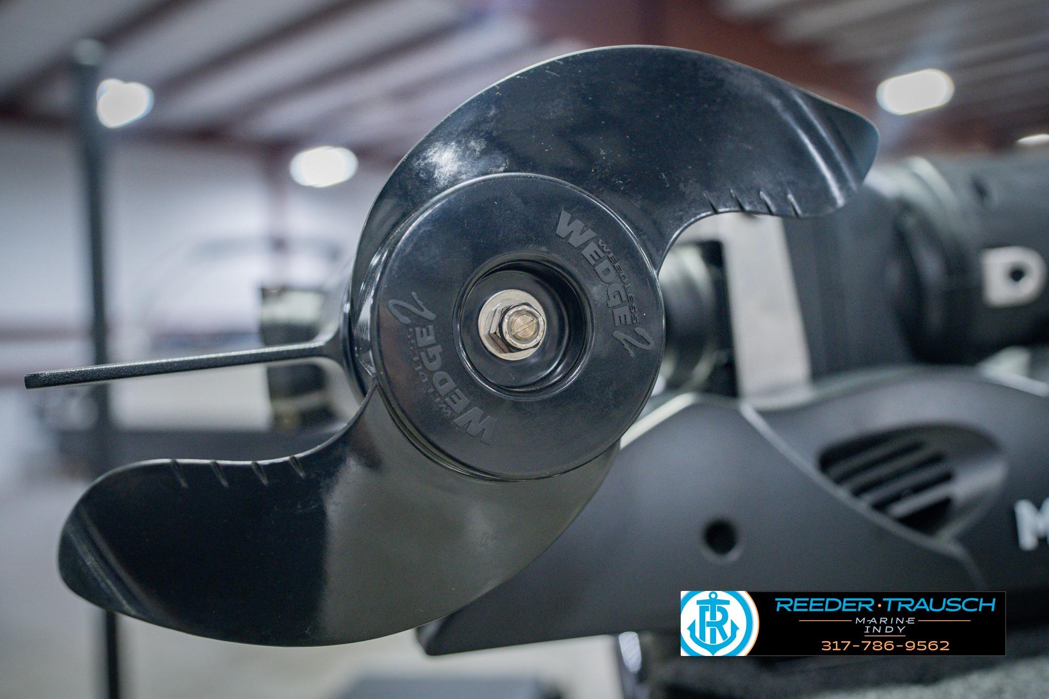 Close-up of a 2026 Lund 1775 Impact XS boat propeller in a showroom.