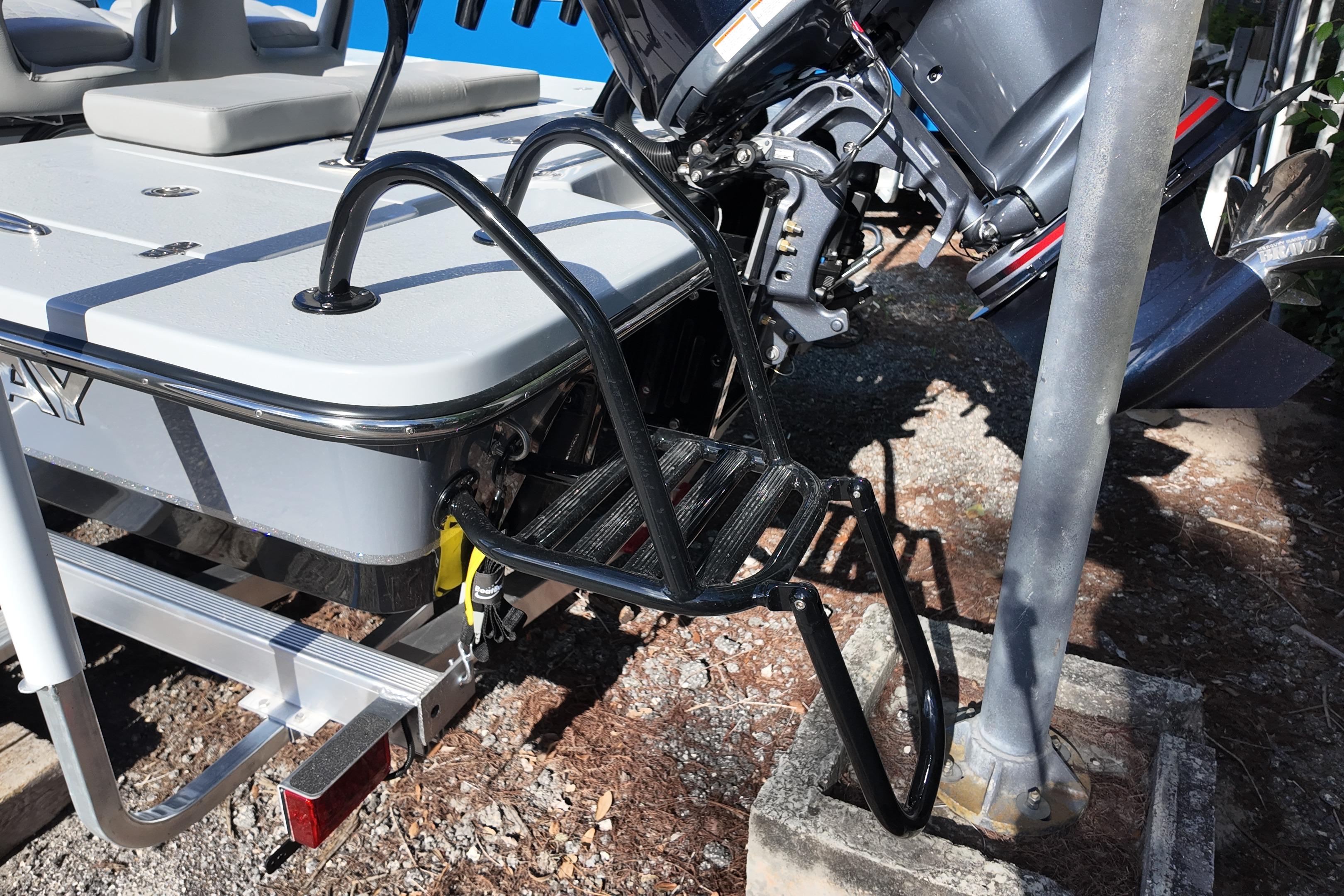 2026 Blazer Bay 675 Ultimate Bay boat with motor and ladder detail.