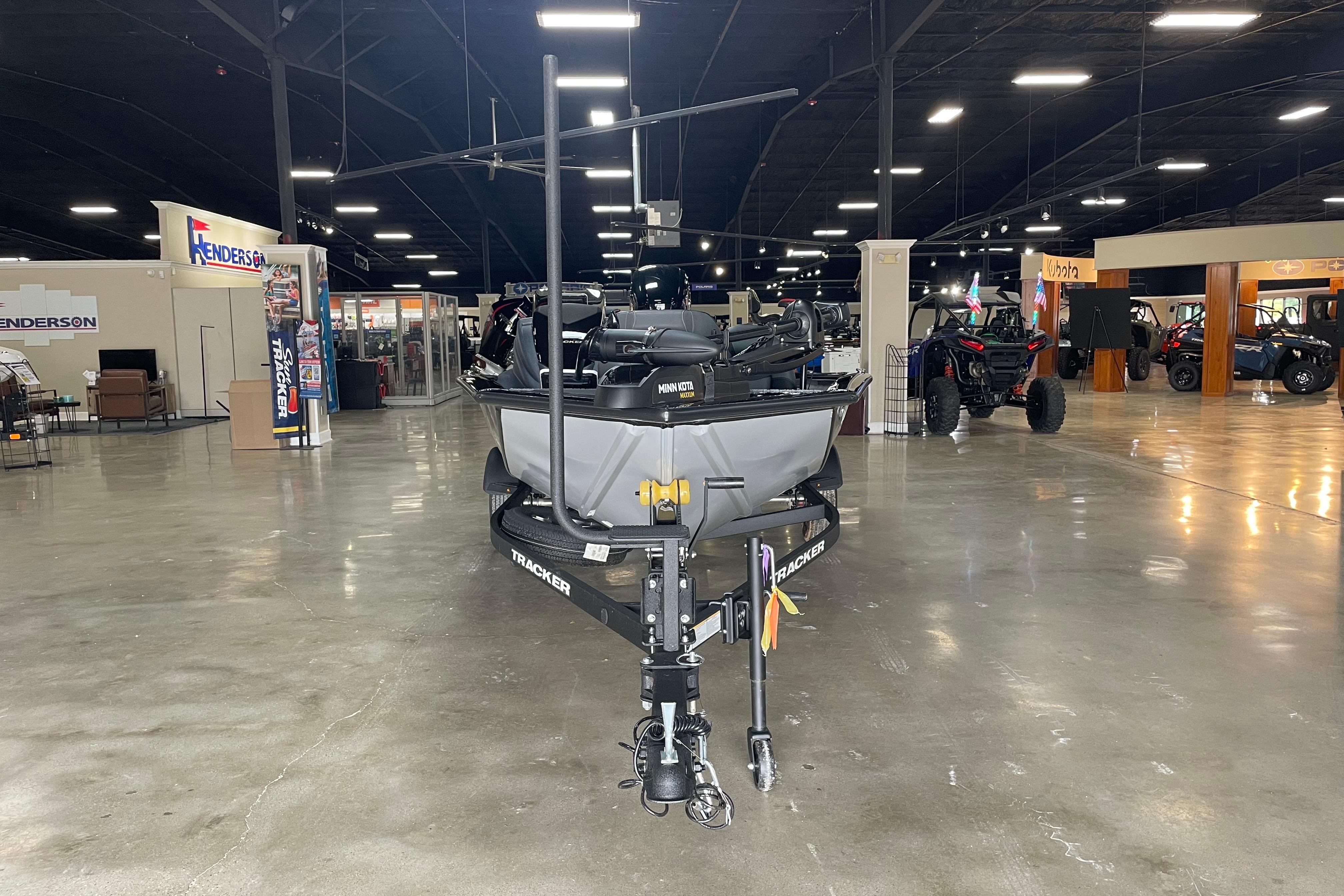2026 Tracker Pro Team 175 Crappie Edition boat displayed in a showroom.