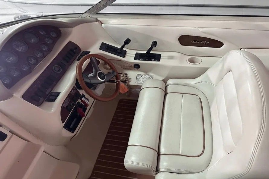 Interior of a 1996 Sea Ray Sun Sport boat with steering console.