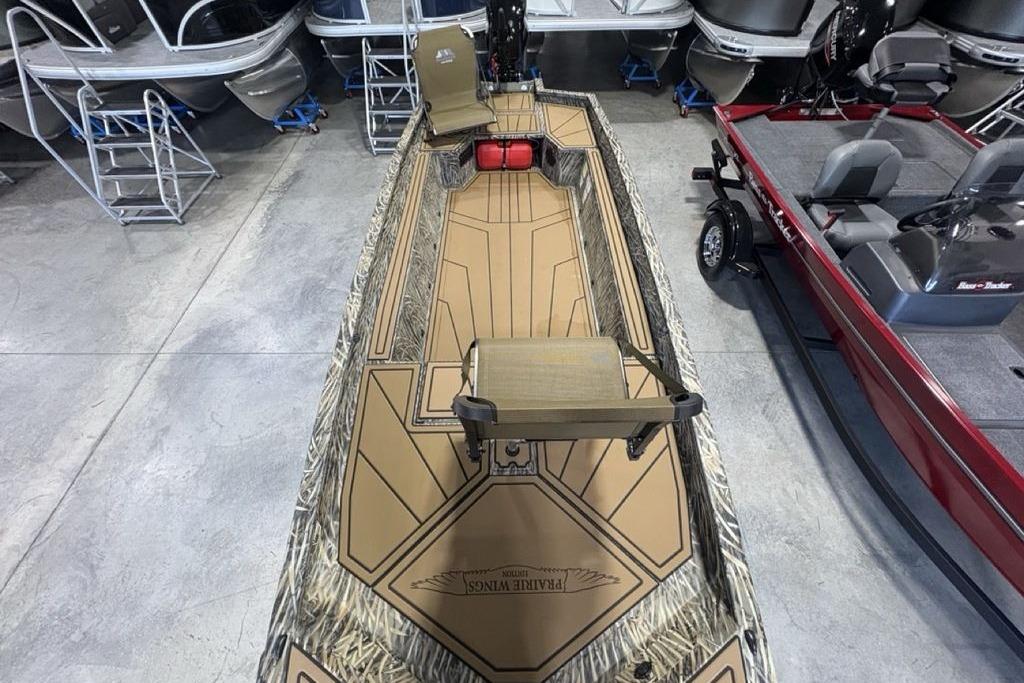 2026 Tracker Grizzly 1650 T Prairie Wings Edition boat in showroom, top view.