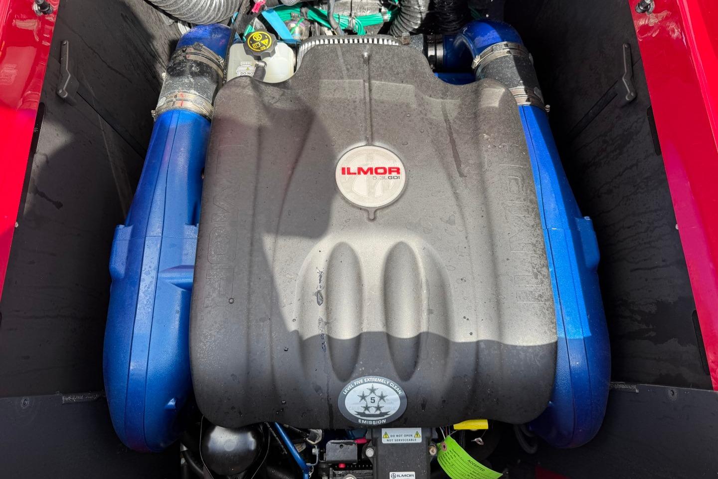 2023 MasterCraft X24 Ilmor engine with blue accents in a boat compartment.