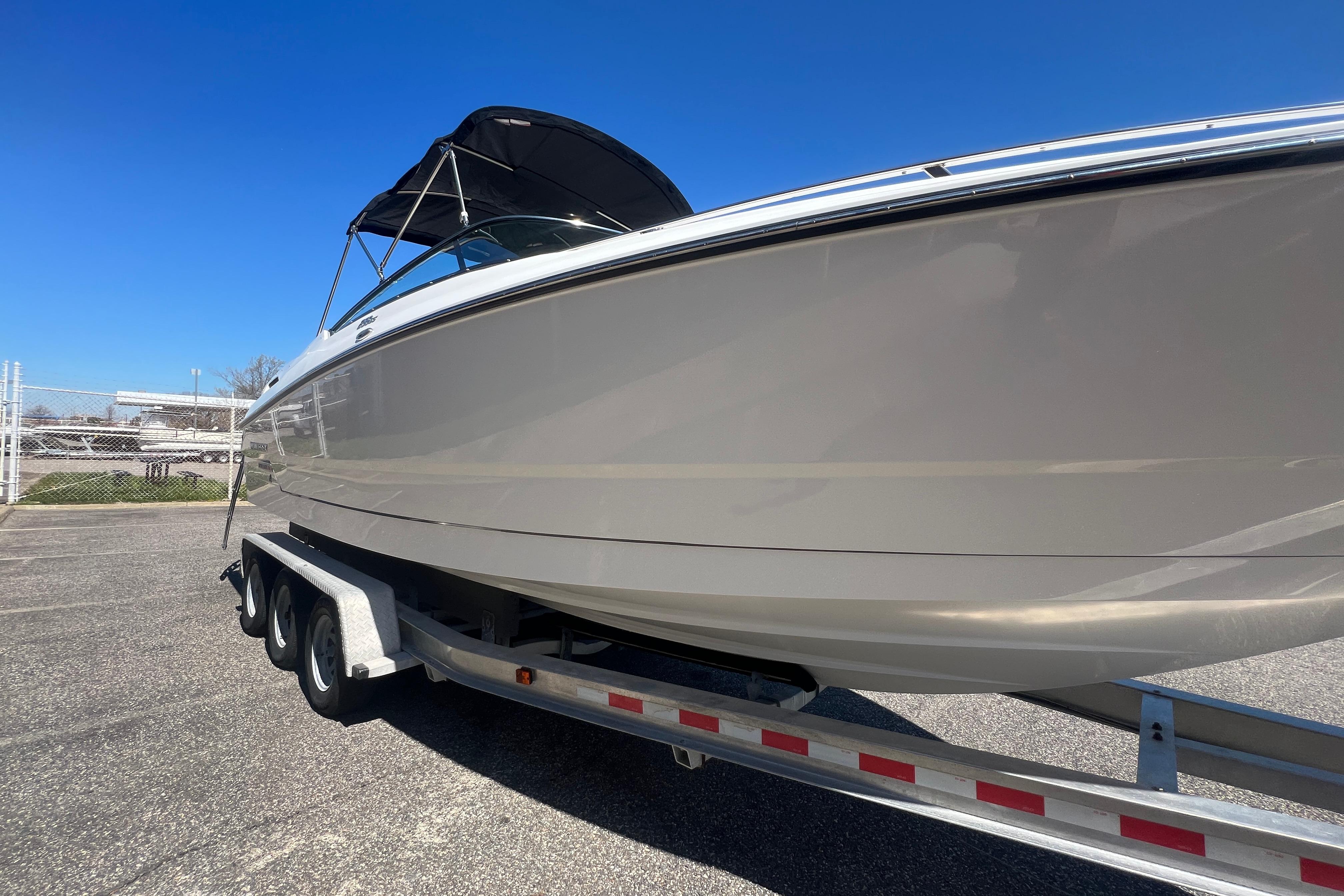 2017 Monterey 298SS Super Sport boat on trailer under clear blue sky.