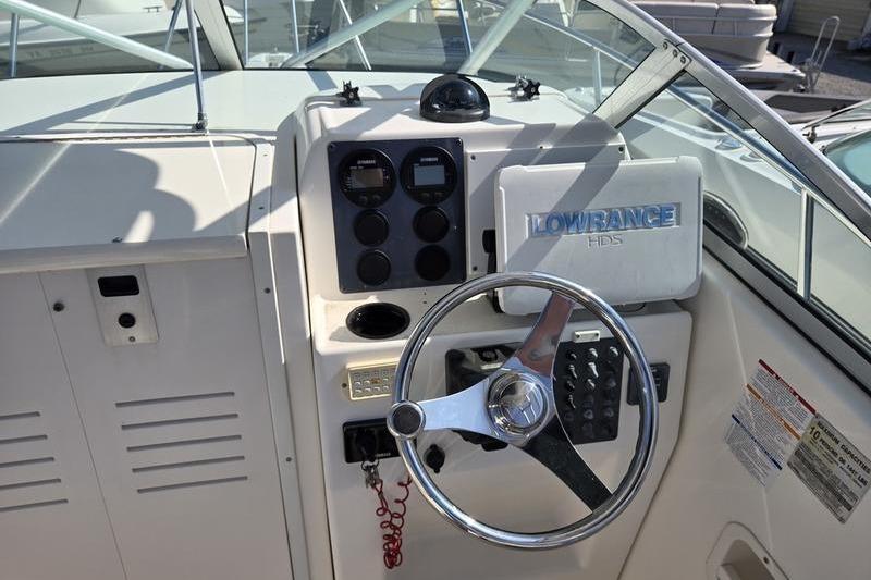 2004 Robalo R235 Walkaround boat dashboard with steering wheel and Lowrance HDS system.