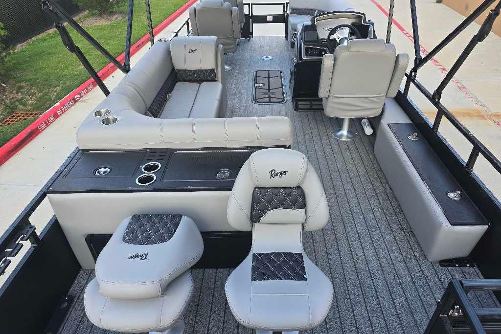 2026 Ranger 223FC boat interior with gray seating and modern helm.