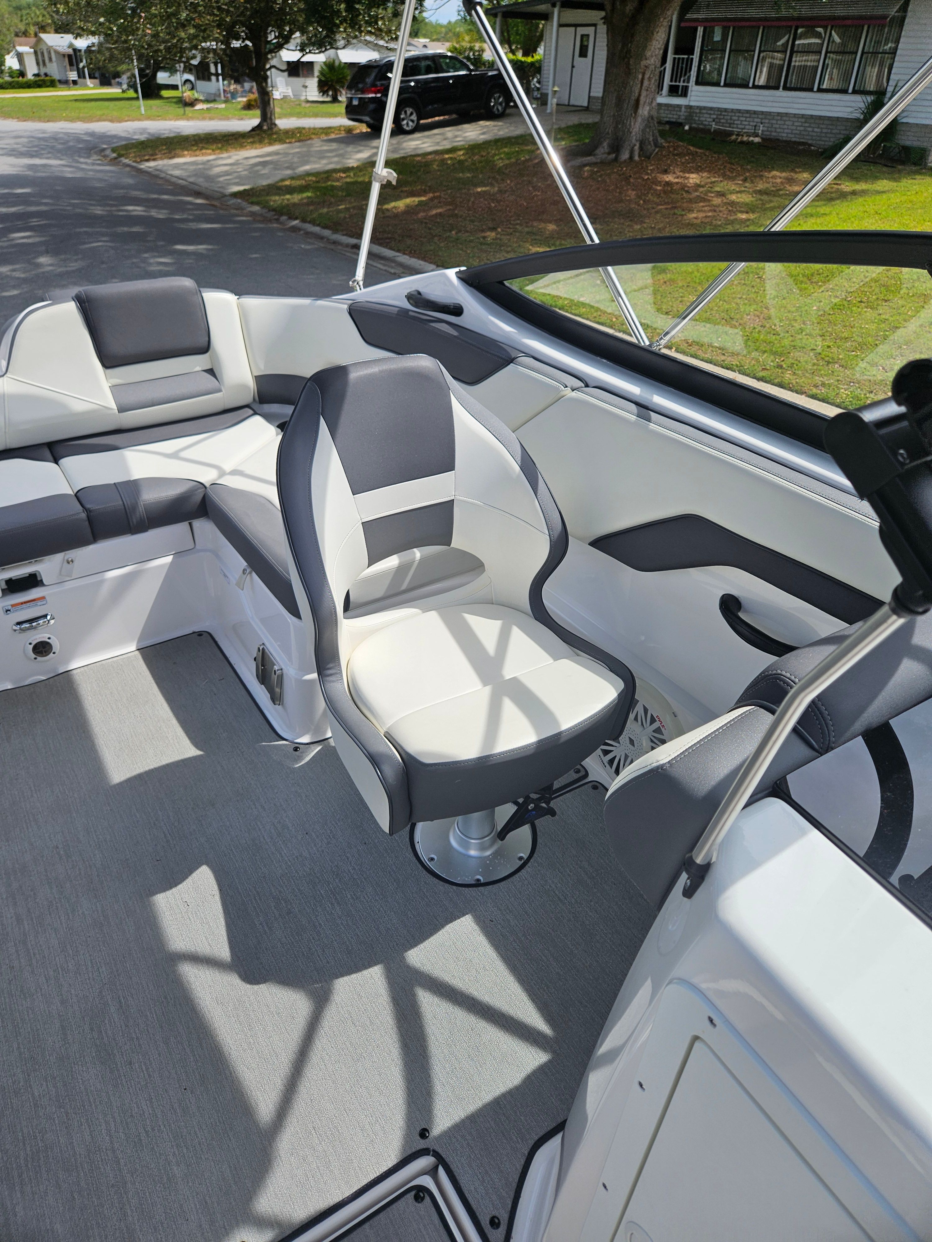 Interior of a 2022 Yamaha SX210 boat with gray seating.