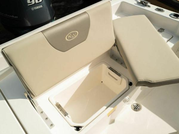 2025 Key West 179 FS boat seat with storage compartment open.