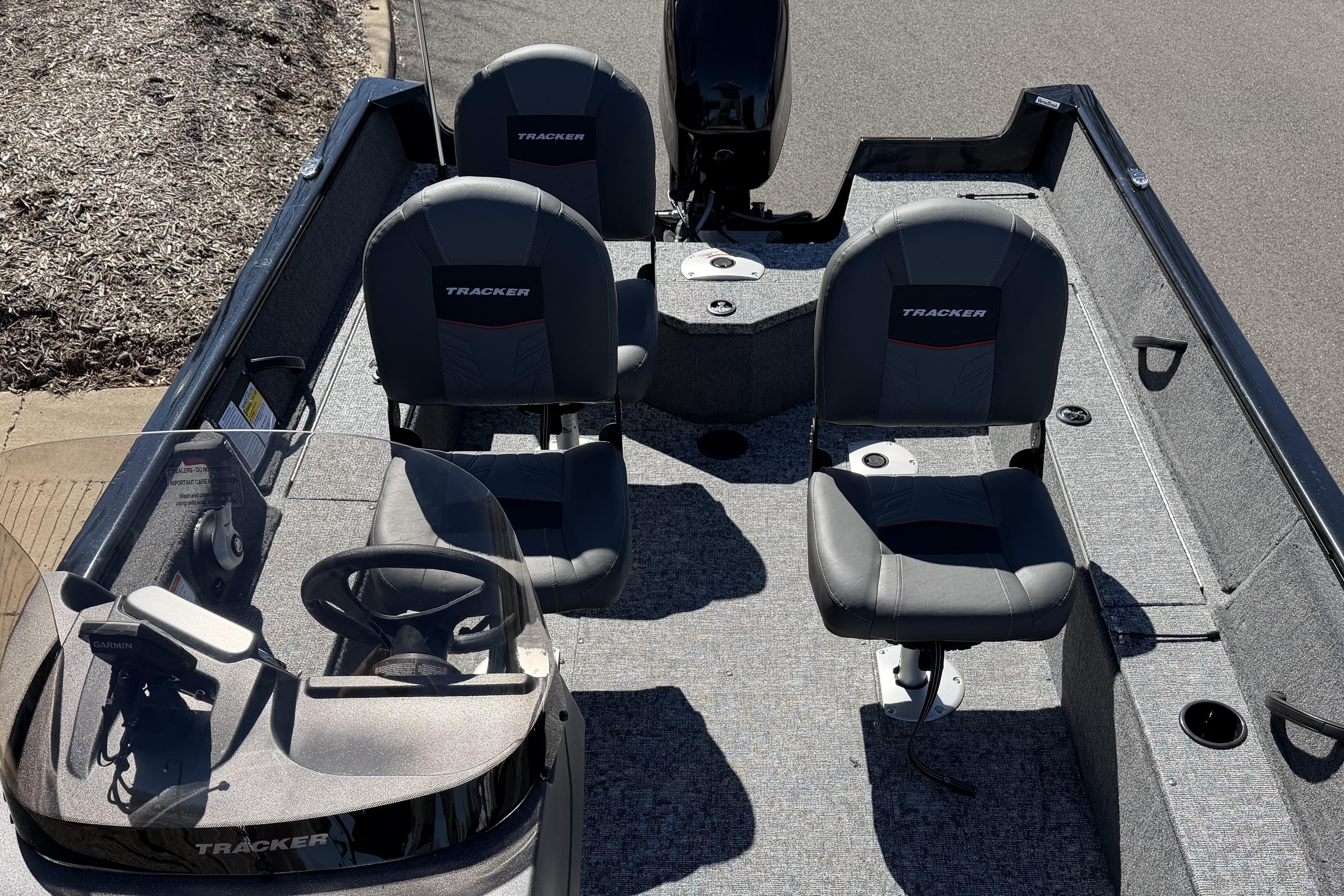 2026 Tracker Pro Guide V-16 SC boat interior with seating and steering console.
