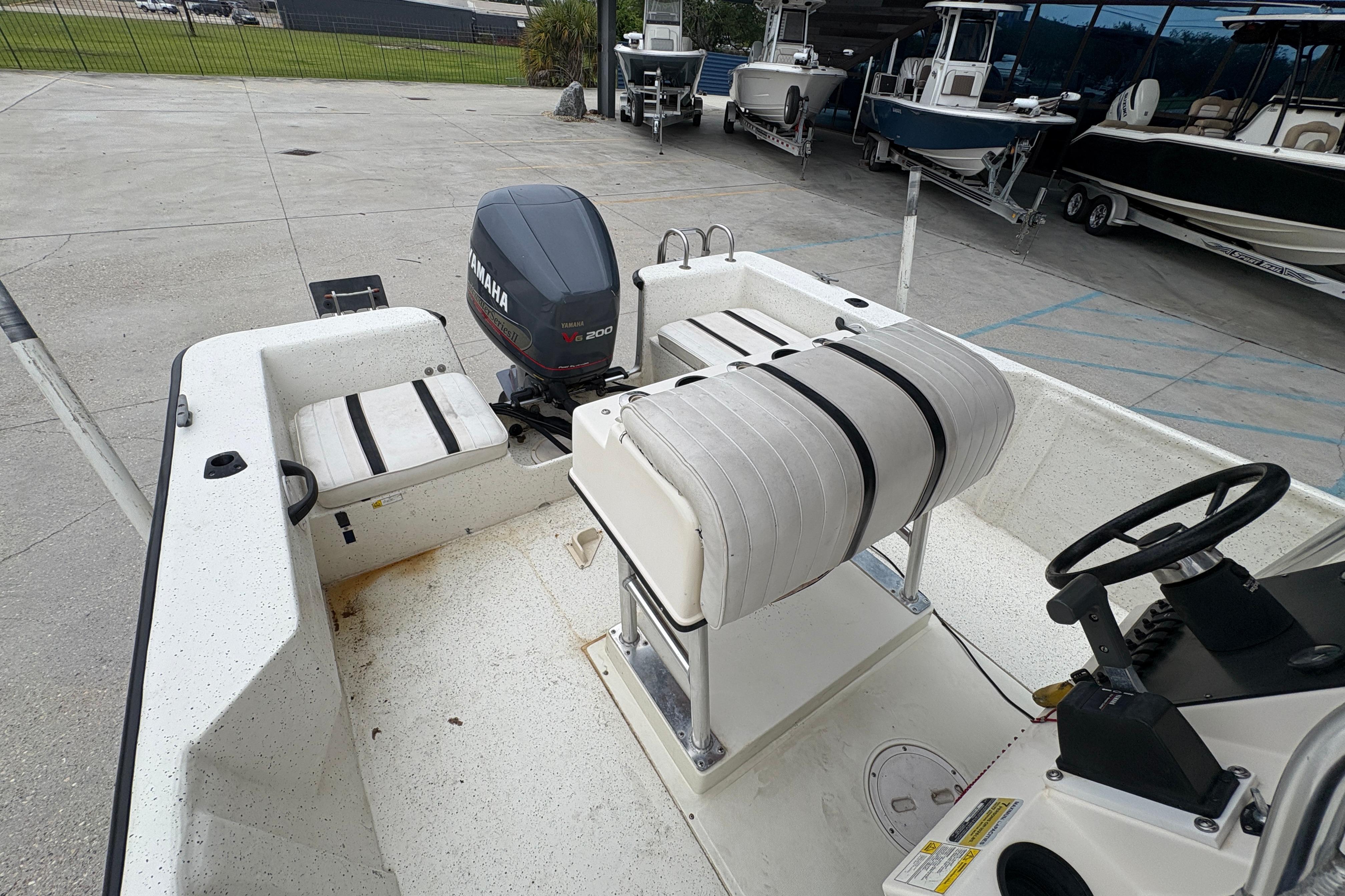 1998 Hydra-Sports 22 Ocean CC boat with Yamaha V6 200 outboard motor, docked outdoors.