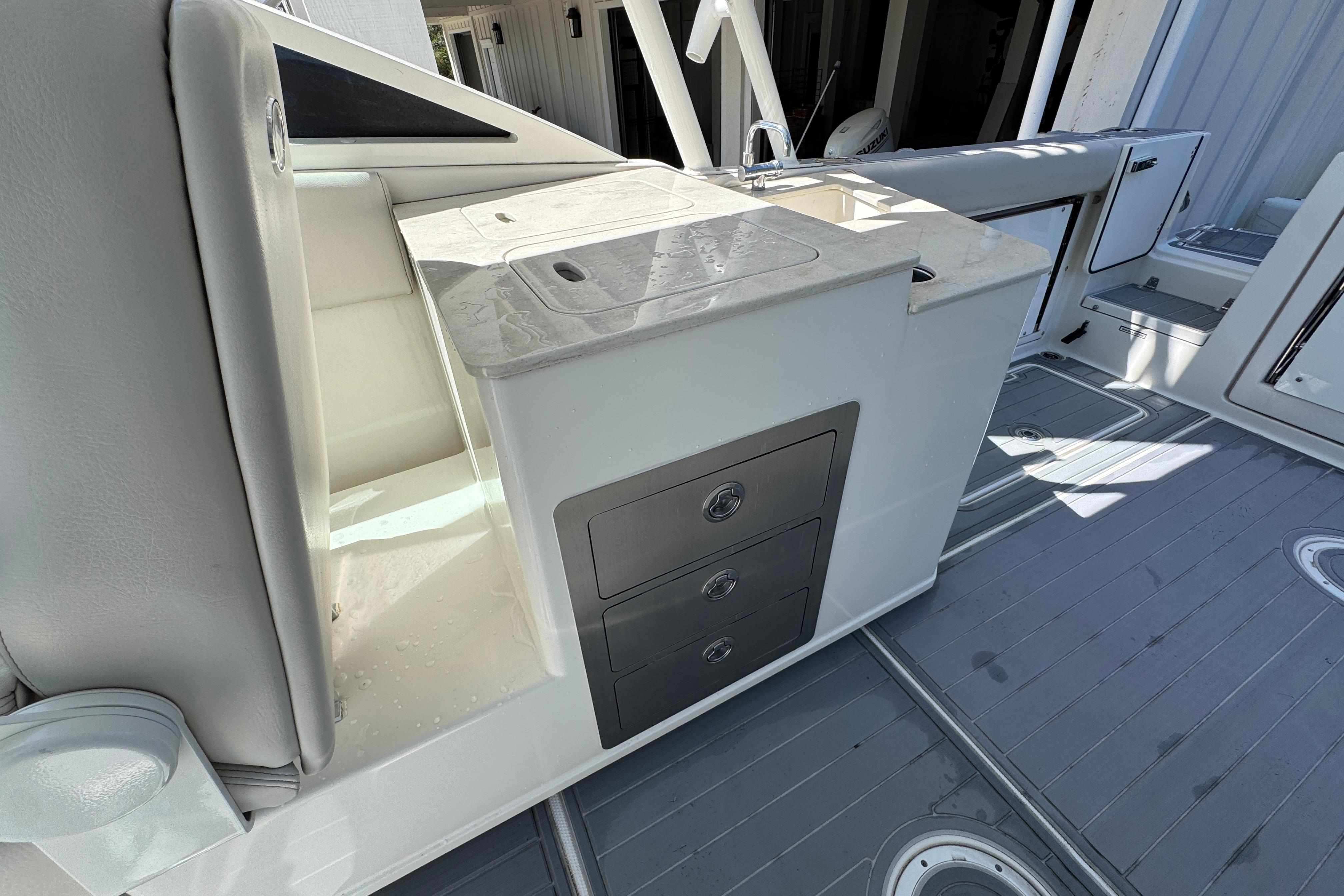 2022 Sailfish 276 DC boat interior with storage drawers and countertop.