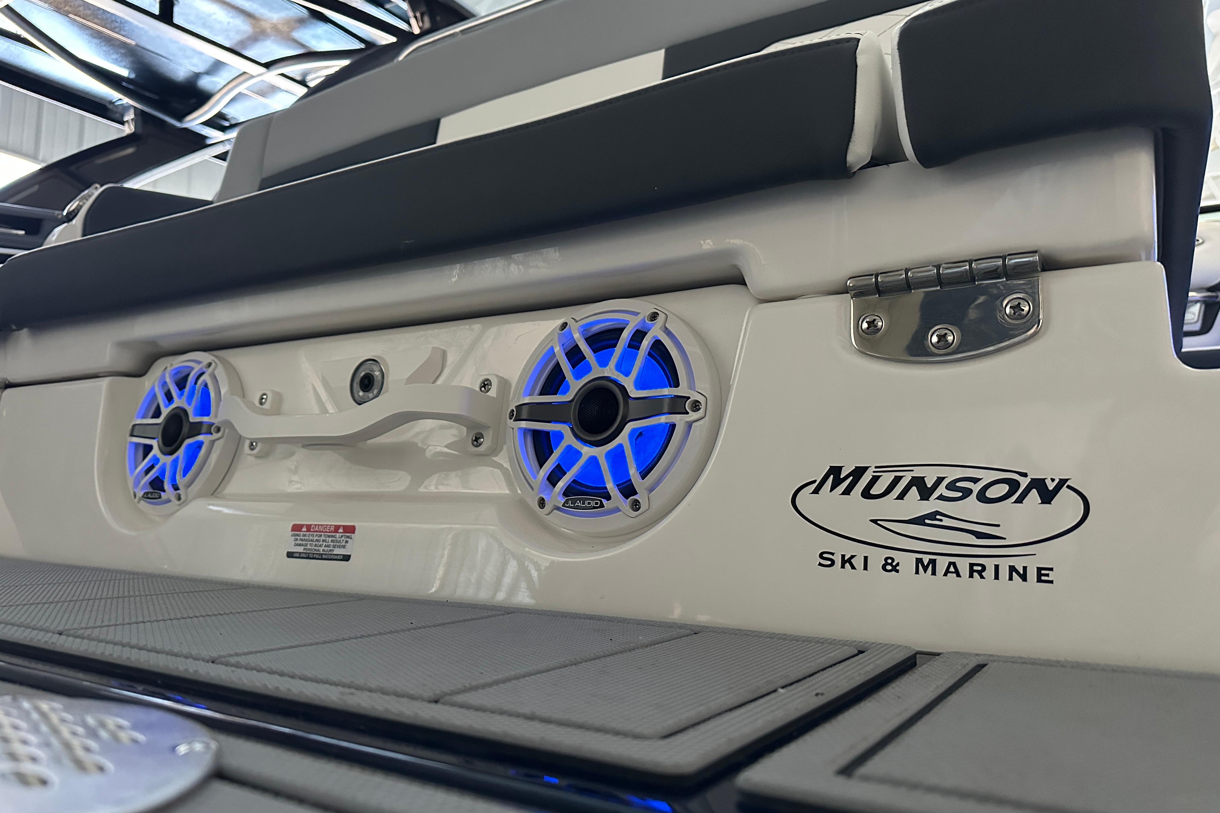 Chaparral SSX 8 2026 boat with blue speakers and Munson logo.