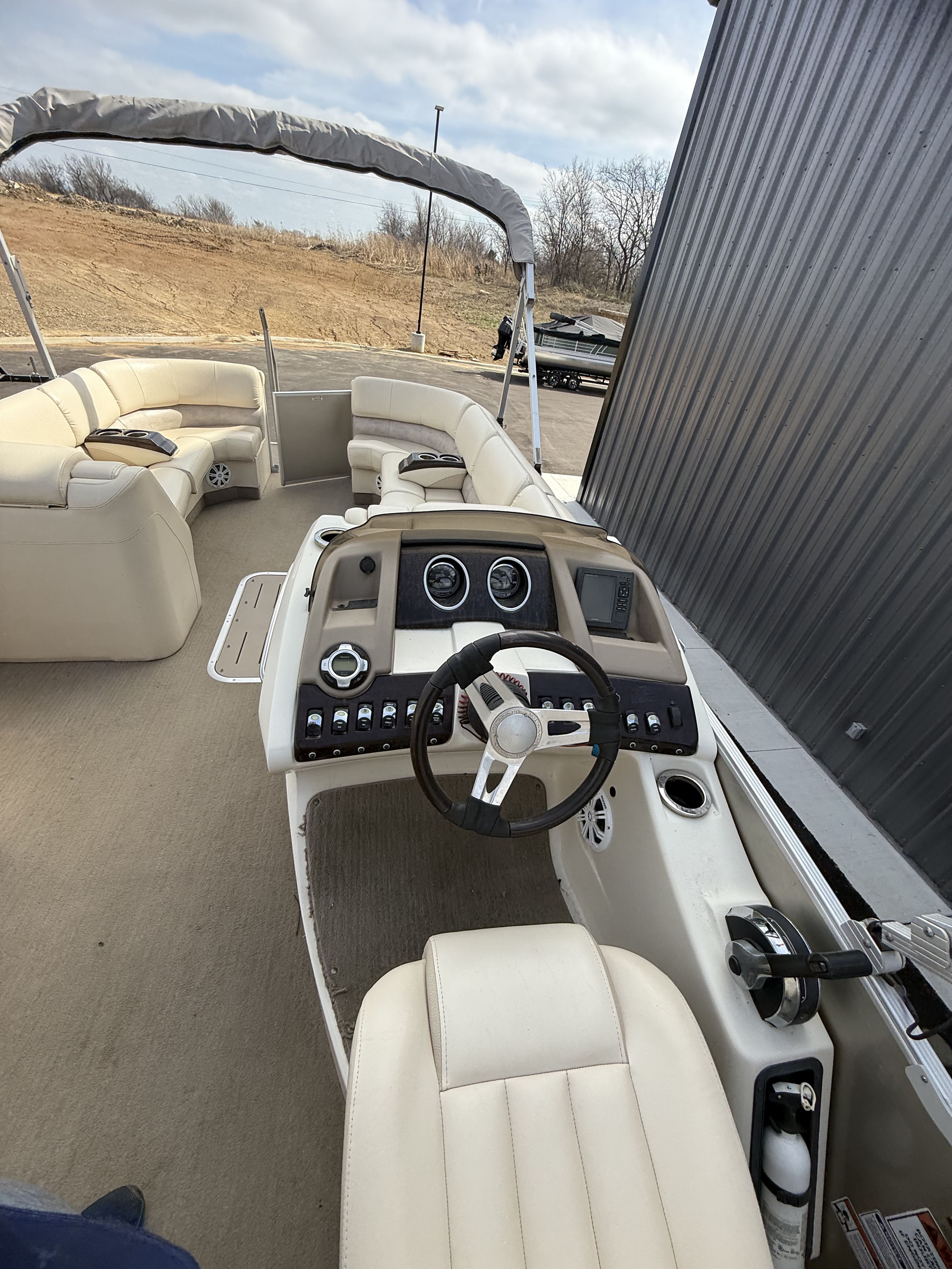 Interior view of a 2014 Bennington 2575RCW-I/O pontoon boat.
