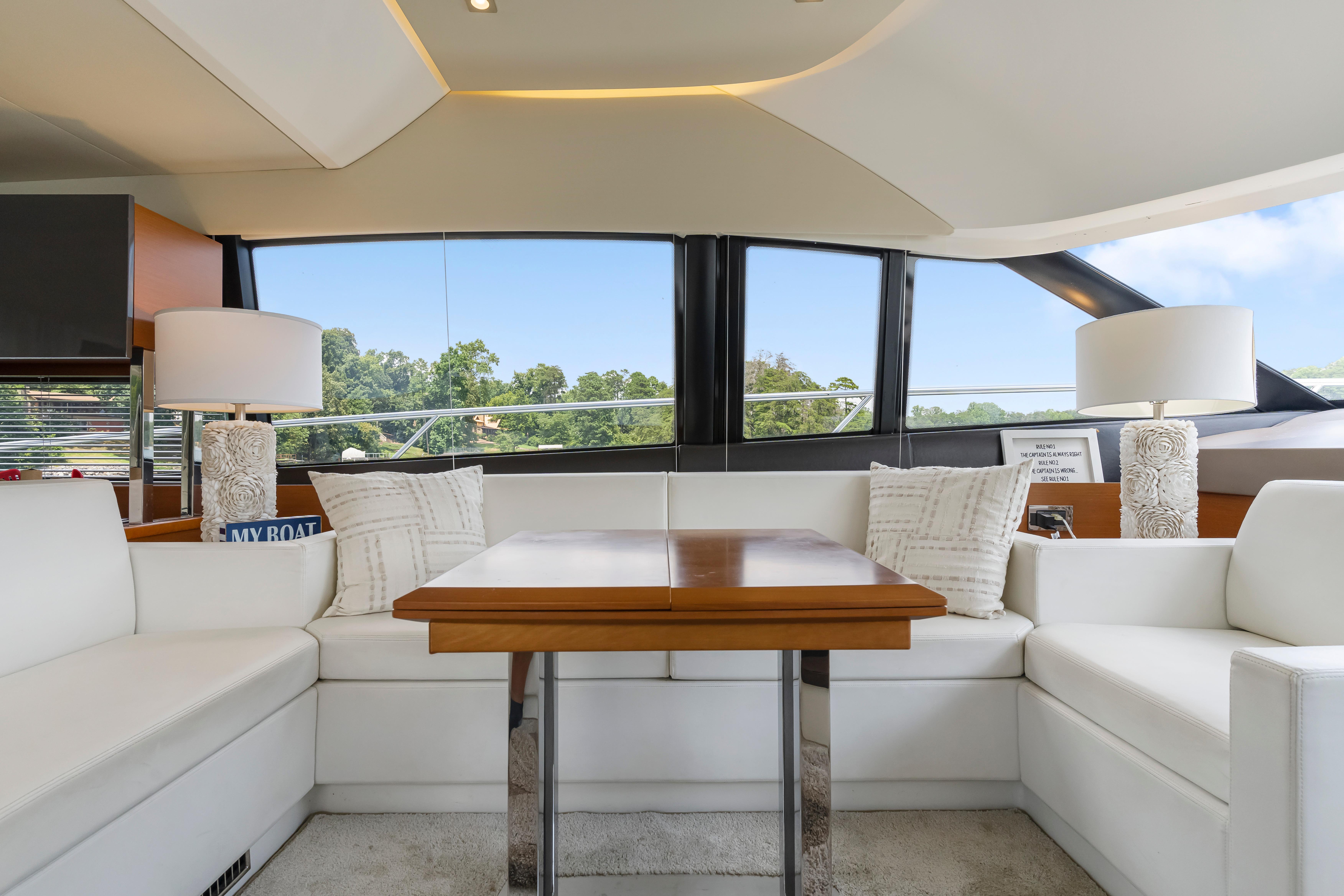 Luxurious interior of 2017 Prestige 500 yacht with elegant seating and decor.
