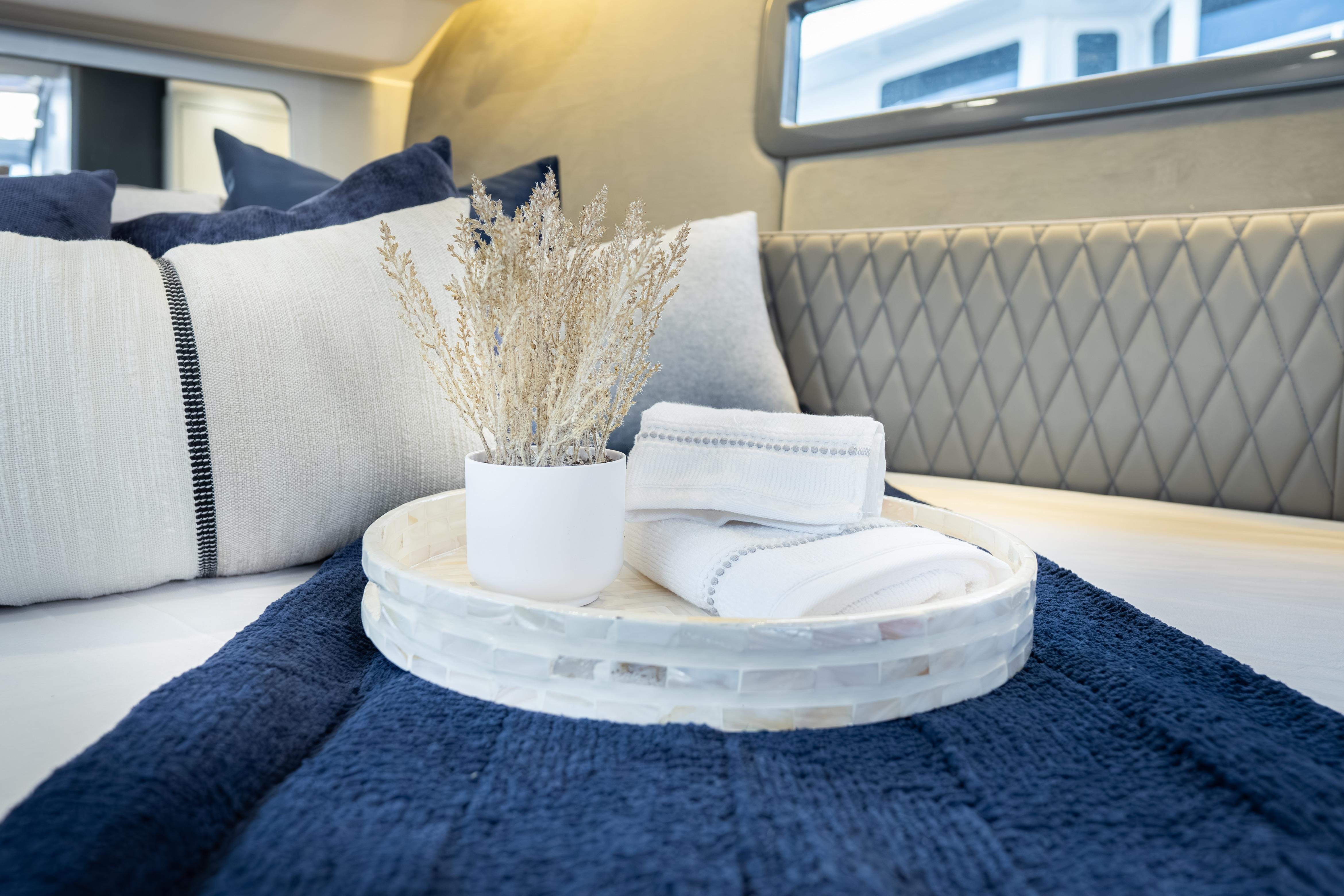 Luxurious interior of 2026 Hanover 347 with elegant bedding and decor accents.