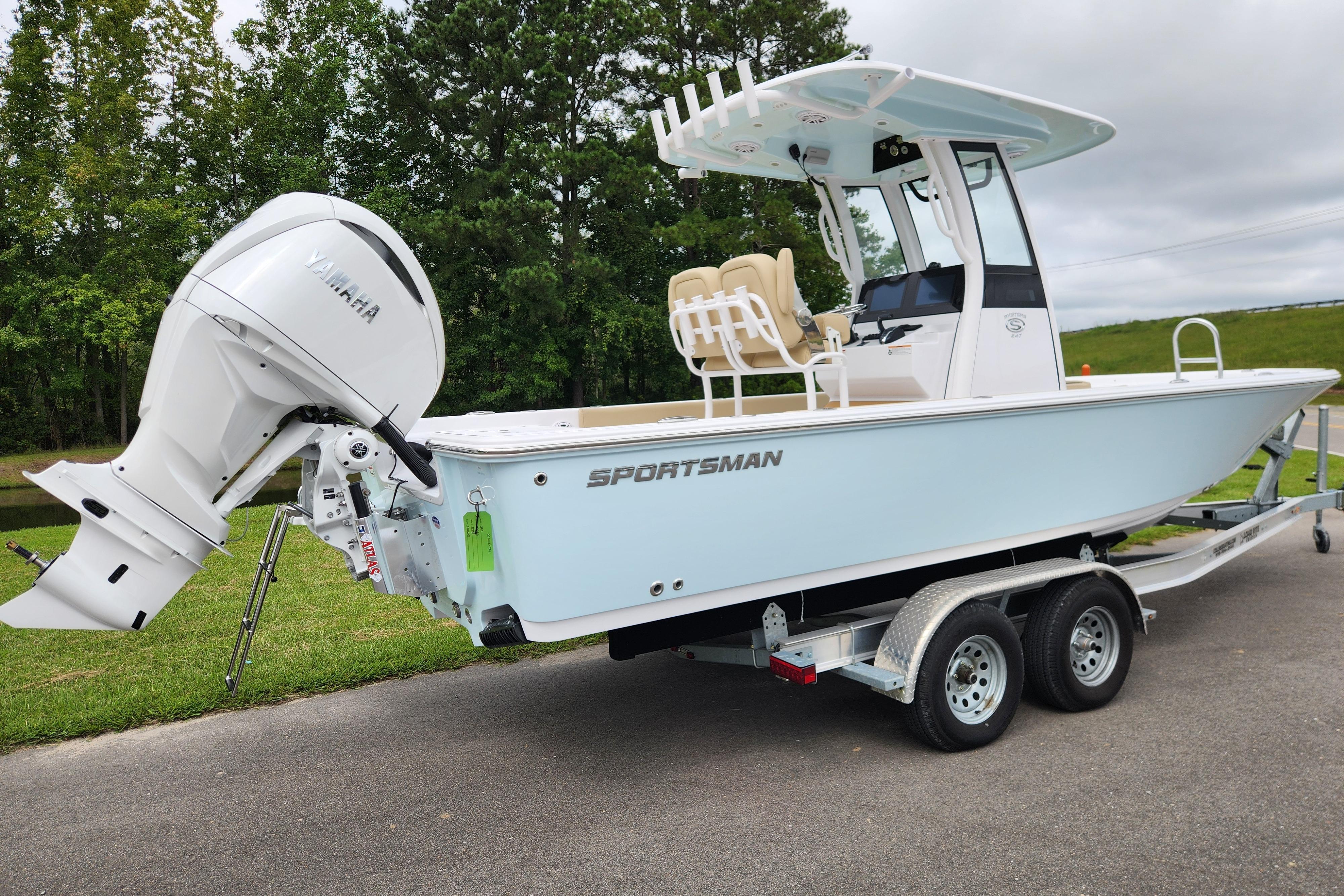 2026 Sportsman Masters 247 Bay Boat on trailer with Yamaha outboard motor.
