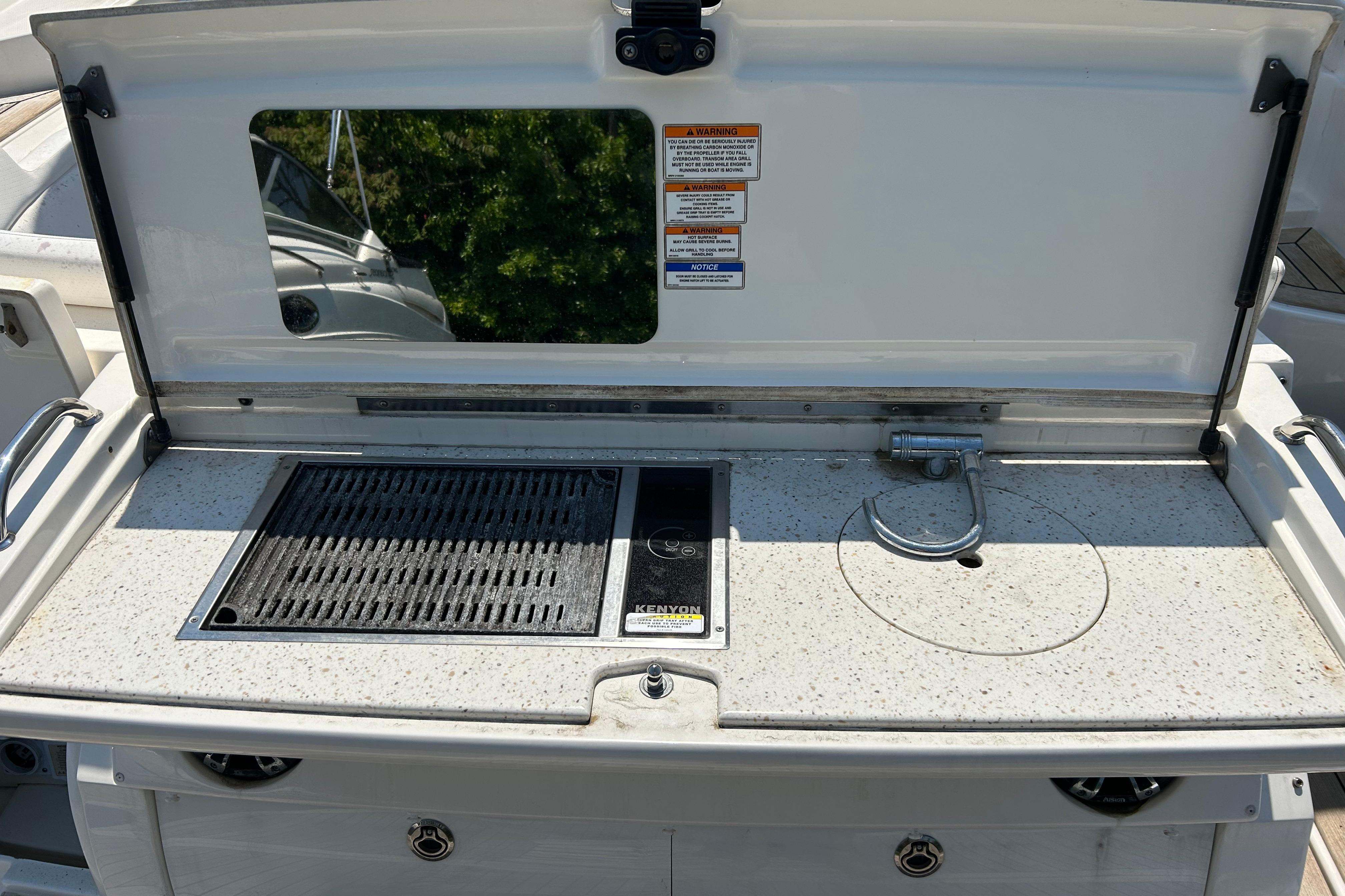 2019 Sea Ray Sundancer 350 boat grill and sink station on deck.