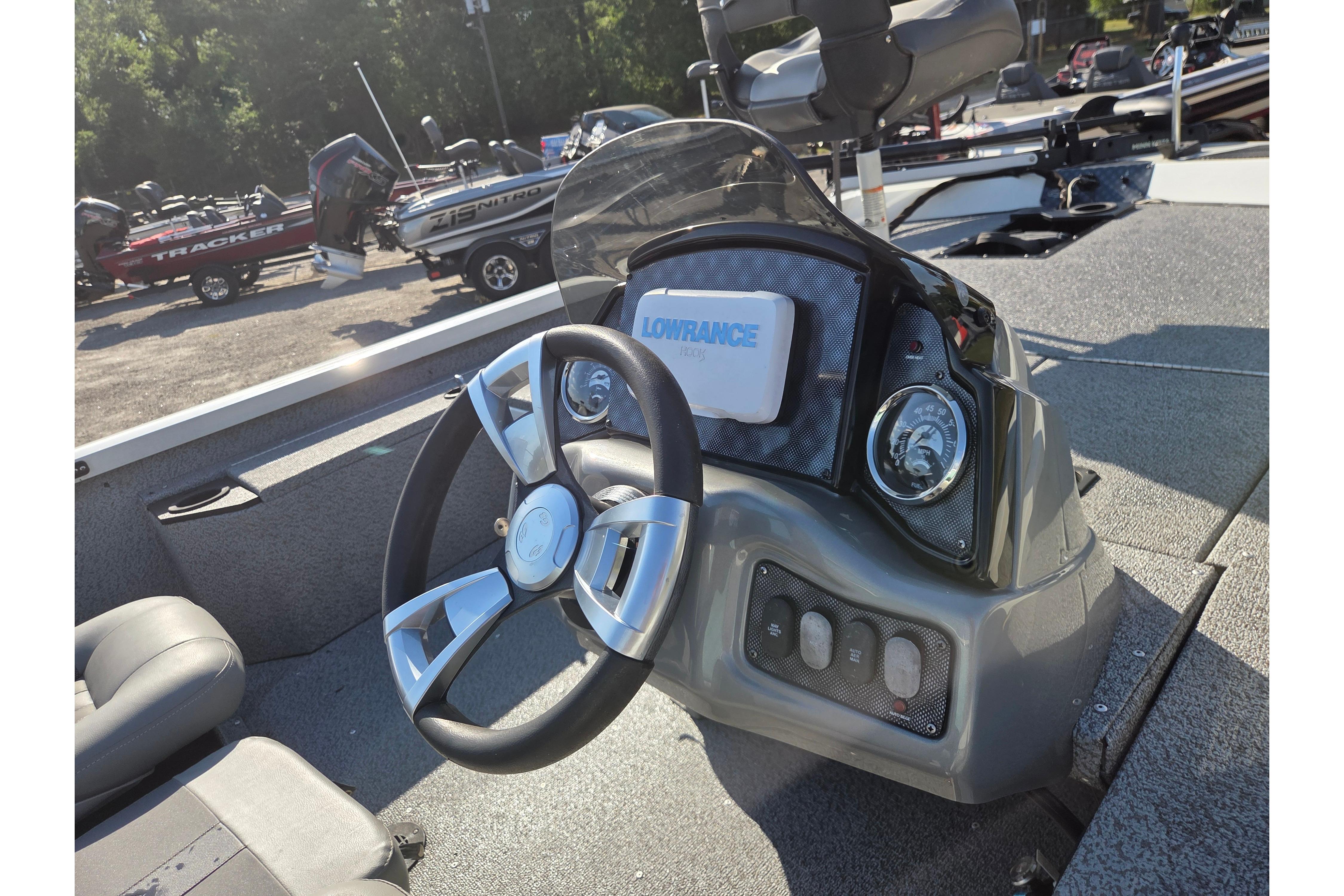 2022 G3 Sportsman 1610 boat dashboard with steering wheel and Lowrance display.