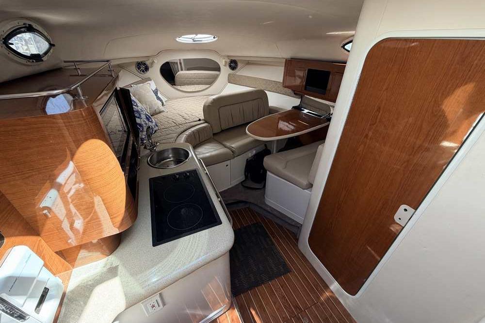 Interior of a 2001 Monterey 282 Cruiser with kitchen, seating, and bed area.
