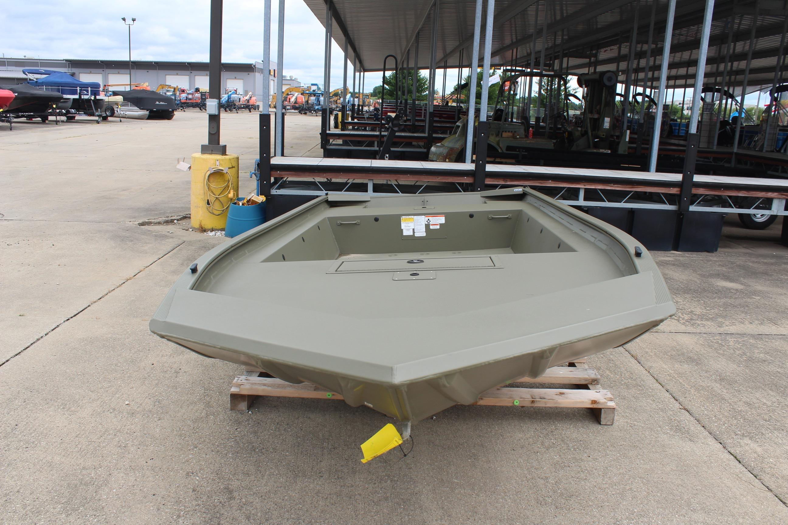 2026 Tracker Grizzly 1754 Utility boat displayed outdoors on a wooden pallet.