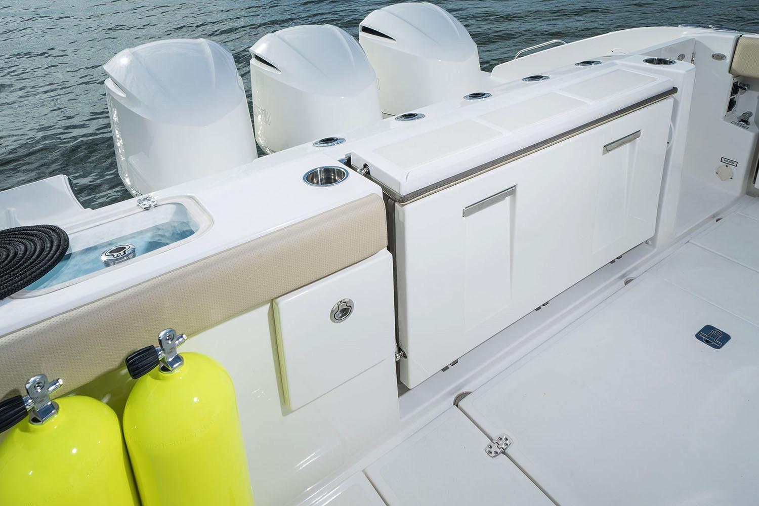 Manufacturer Provided Image: 2025 Pursuit DC 365 Dual Console boat deck with storage and scuba tanks.