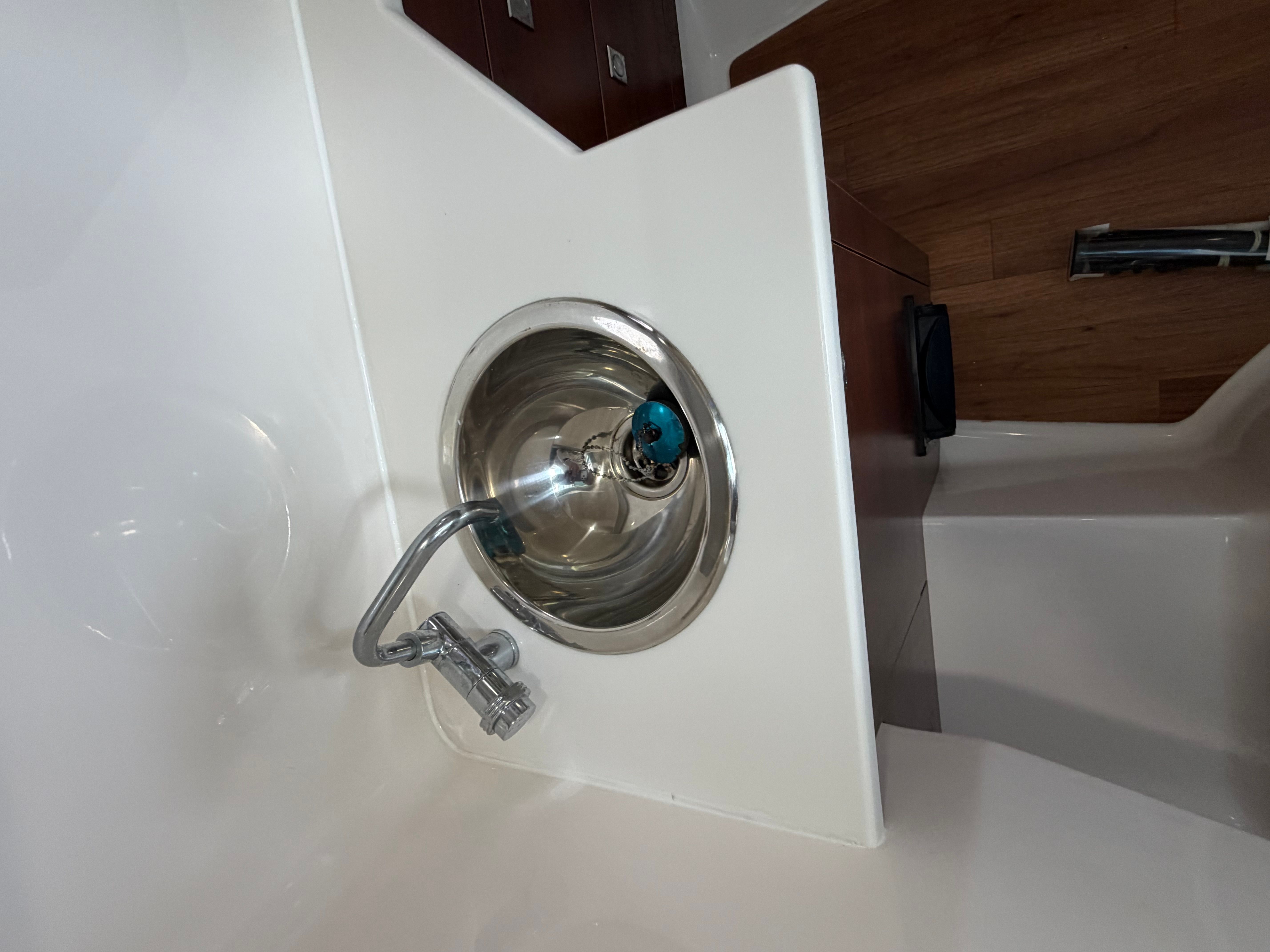A modern sink with a faucet on a boat.