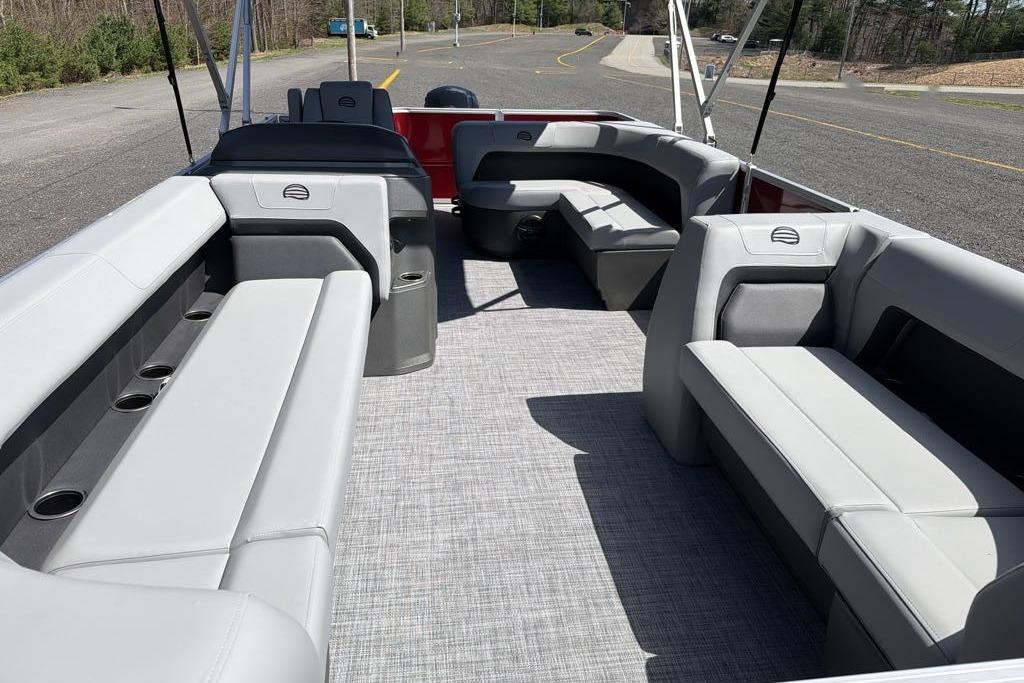 2026 Sun Tracker Party Barge 18 DLX interior with spacious seating and cup holders.