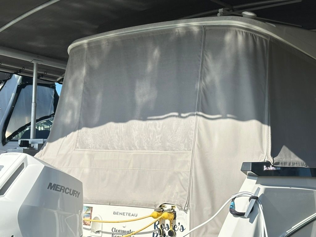 Beneteau Gran Turismo 32, 2024, with Mercury engine, docked.