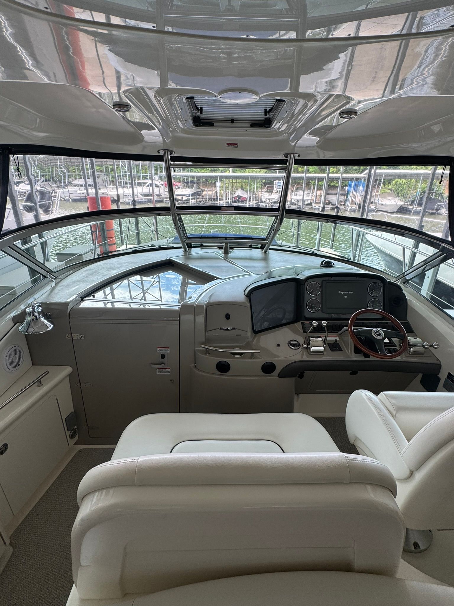 Interior view of a 2007 Sea Ray 40 Sundancer helm with modern instruments.
