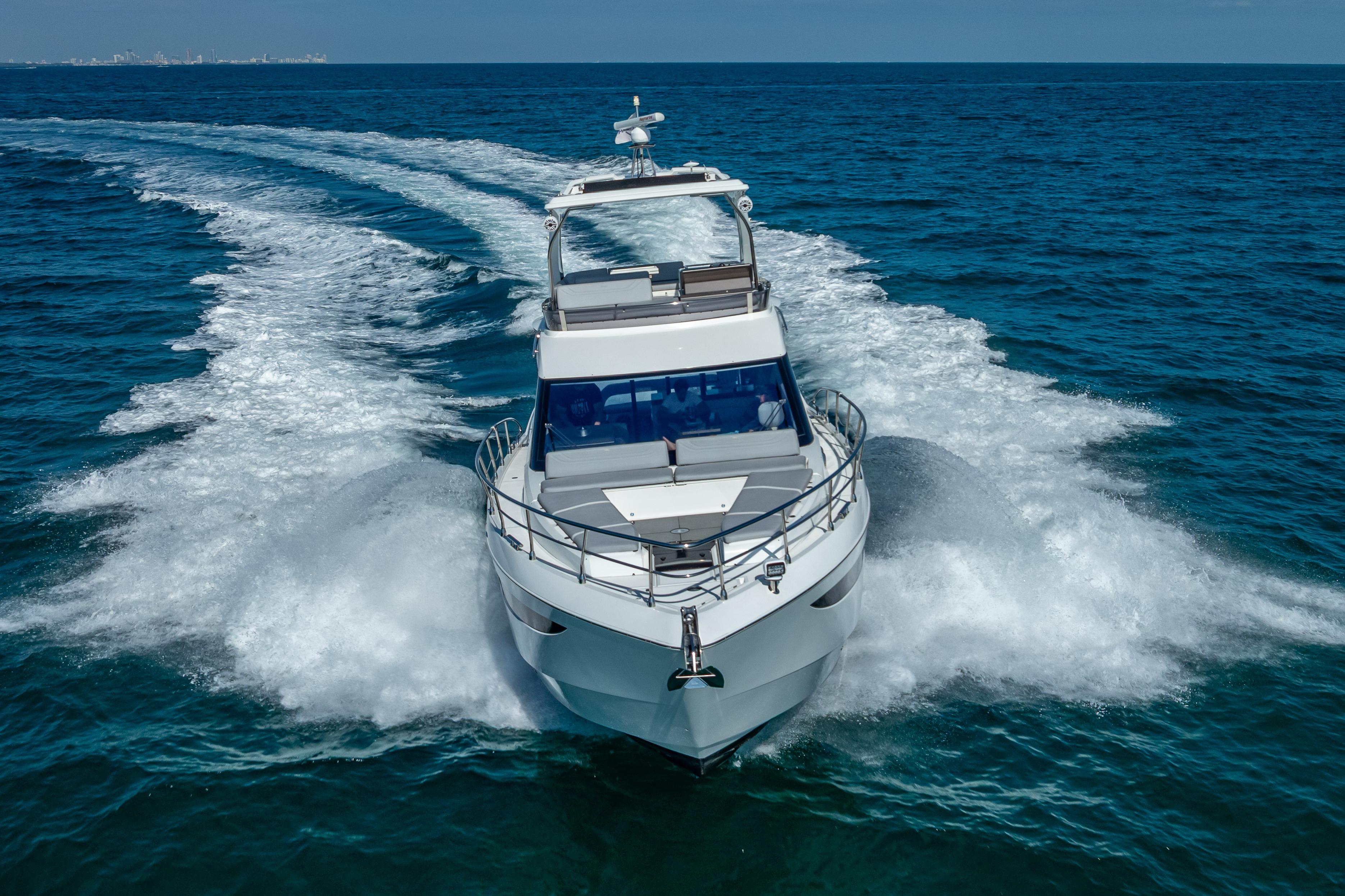 2021 Galeon 500 Fly yacht cruising on open sea, creating dynamic water trails.