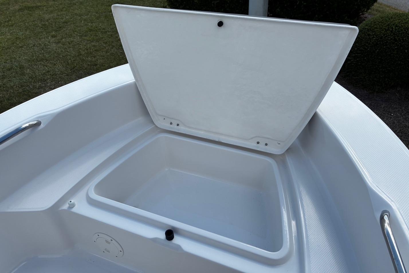 2026 Robalo R160 Center Console boat storage compartment open, showcasing interior space.