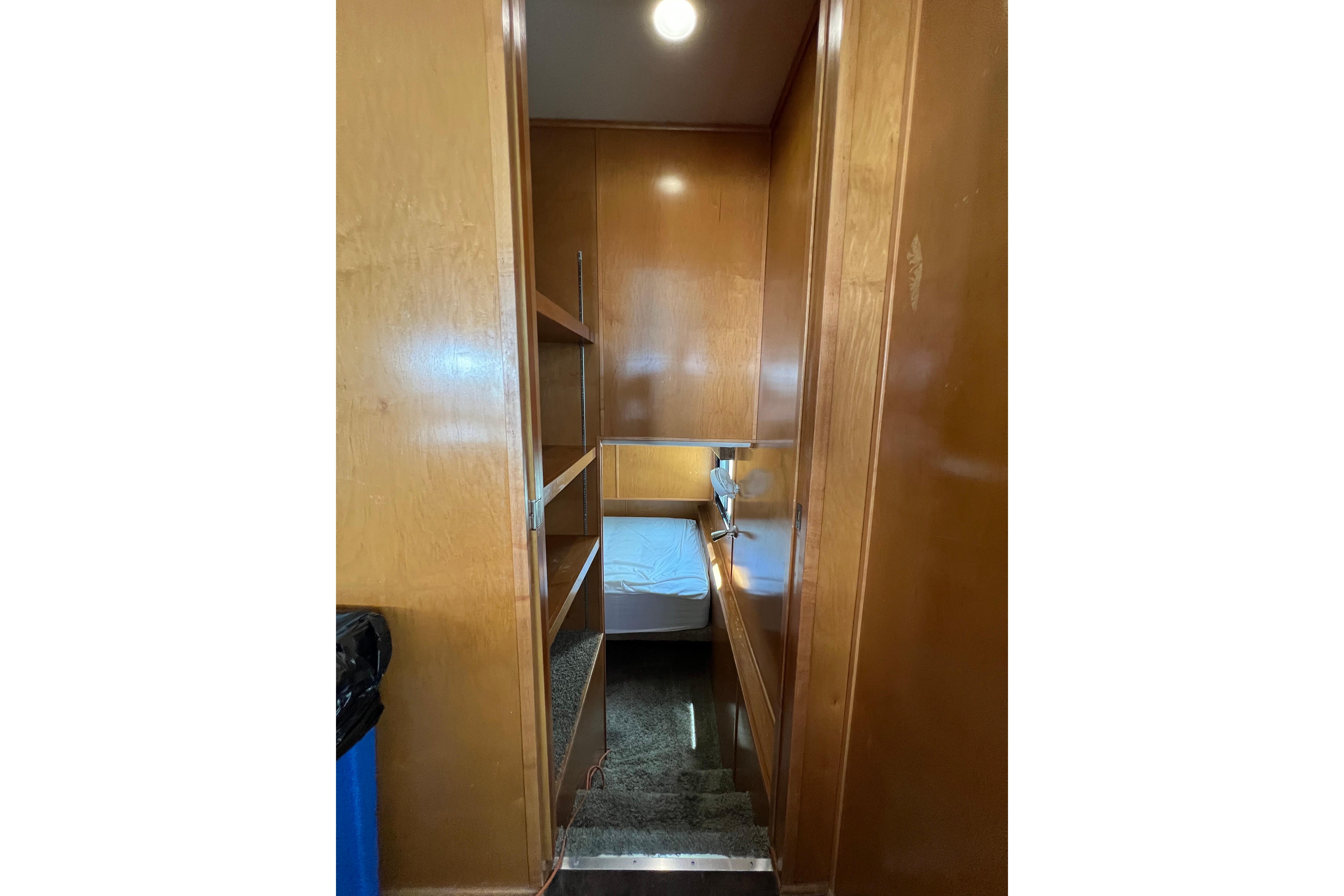 Interior of 2013 Destination Yacht Lotta Yachta, featuring wooden walls and cozy sleeping area.