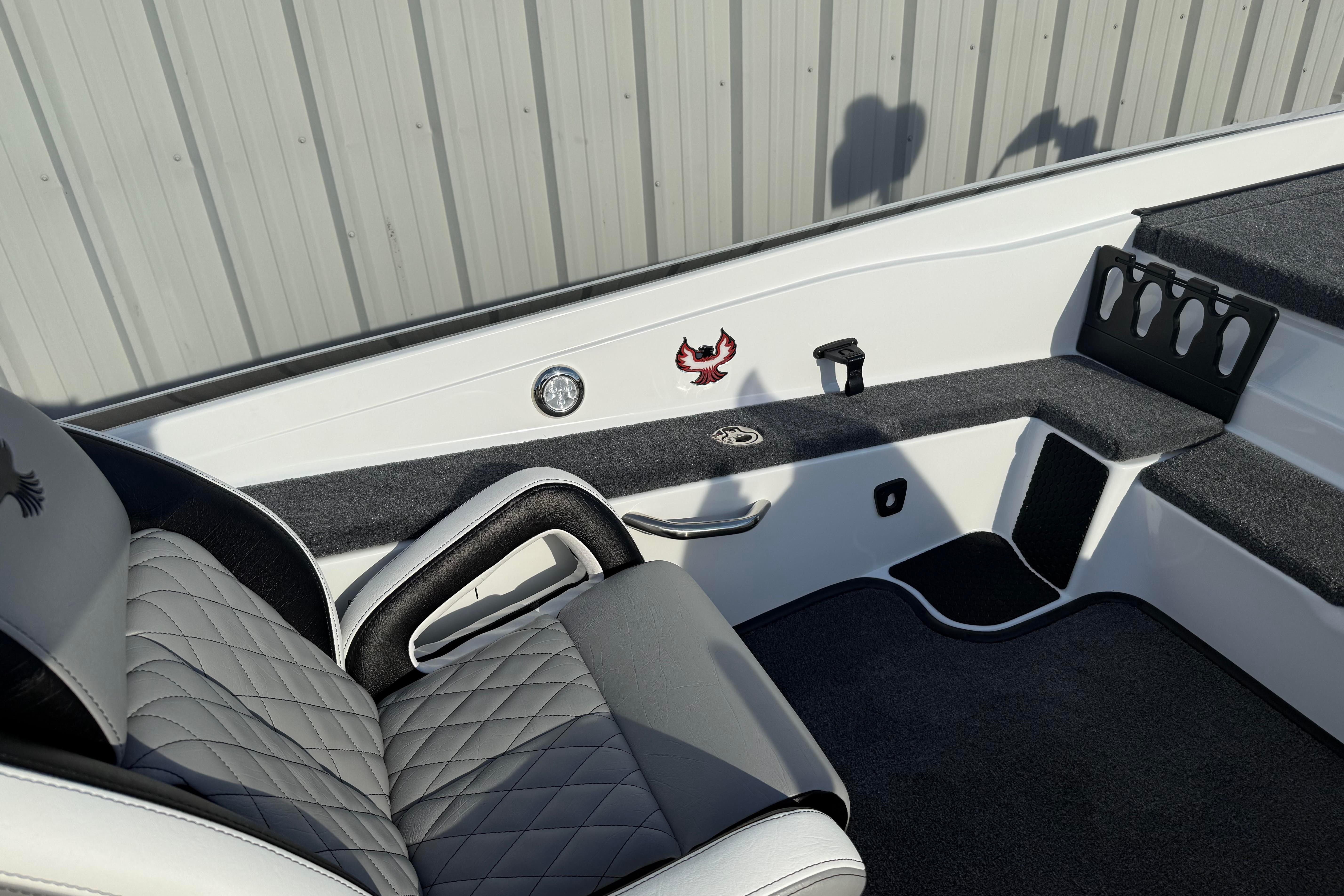 Interior of 2027 Phoenix 721 ZXL boat with quilted seating and sleek design.