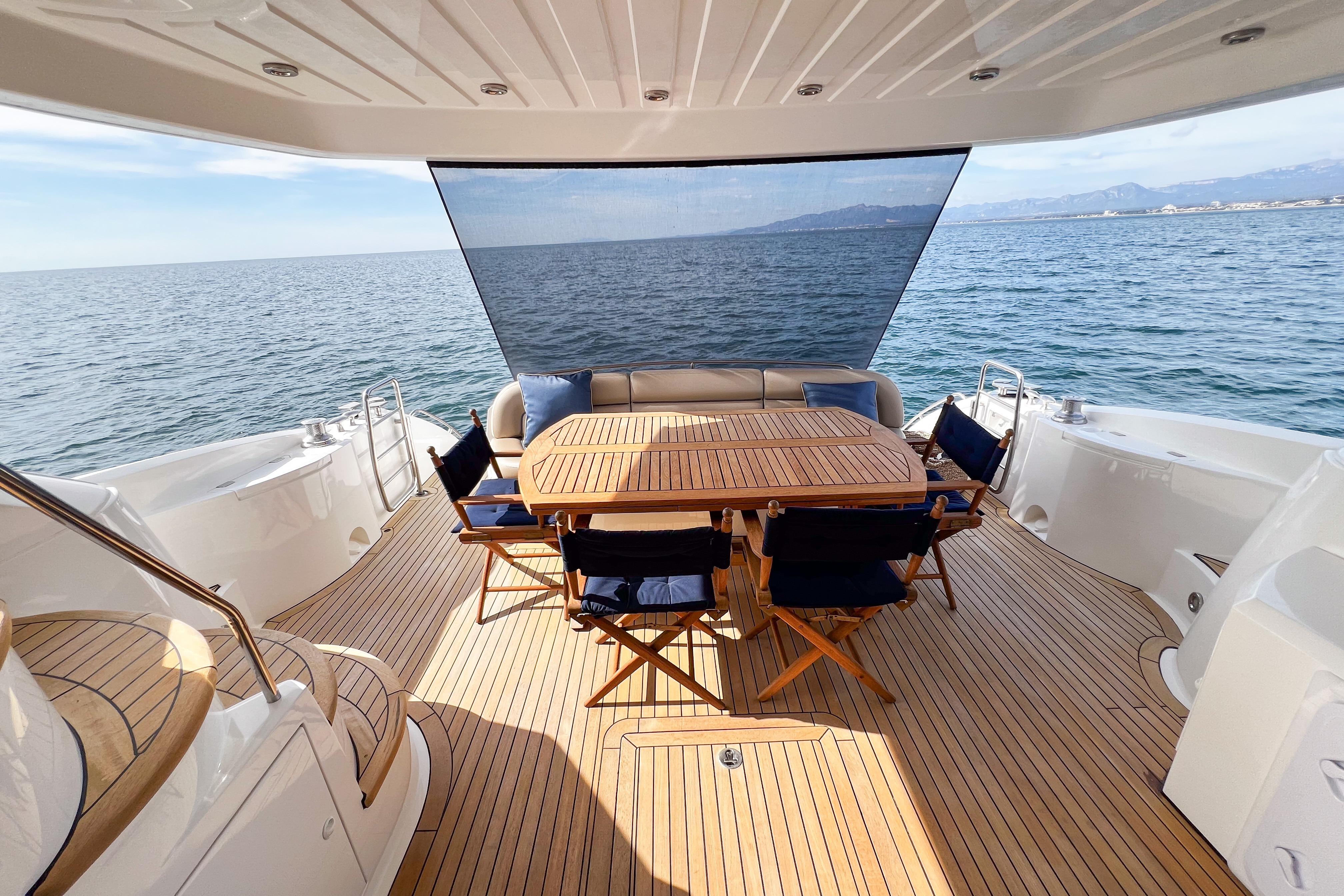 Luxurious 2007 Sunseeker Manhattan 66 yacht deck with elegant seating and ocean view.