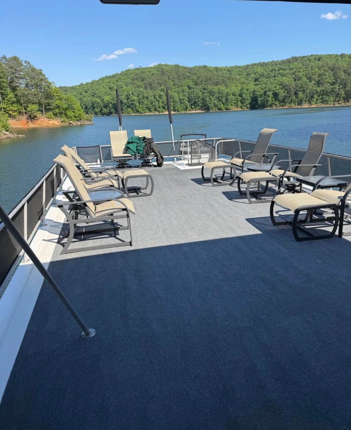 1998 Stardust Cruisers houseboat on a serene lake.