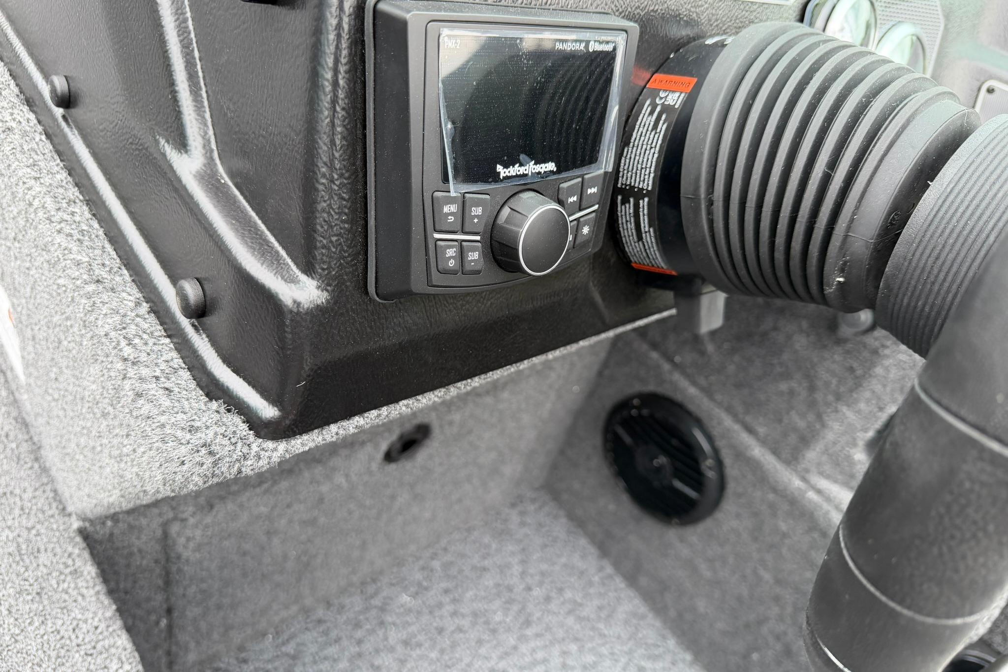 2027 Lund 2075 Impact XS boat dashboard with audio controls and ventilation system.