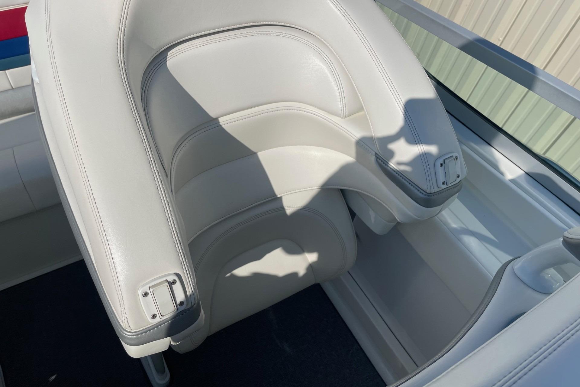 2004 Formula 382 FASTech boat seat with white leather upholstery and sleek design.