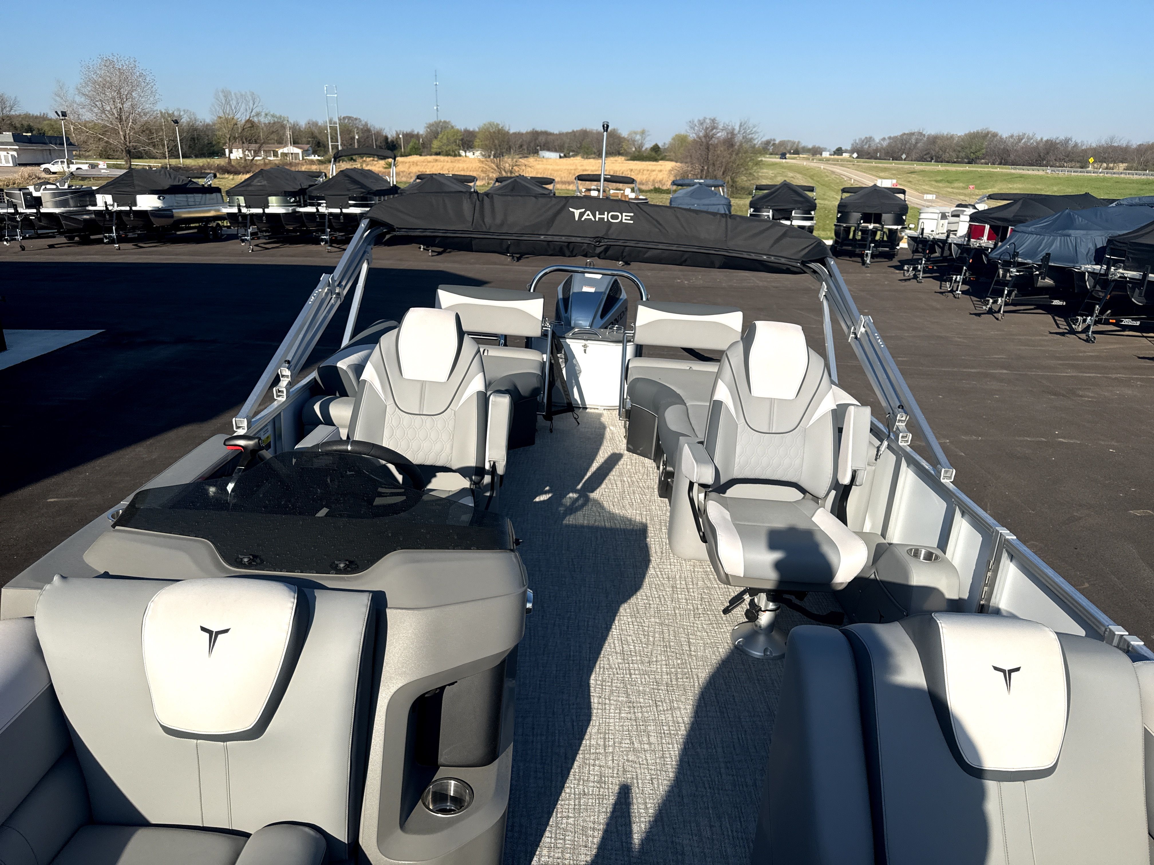 2026 Tahoe LTZ Quad Lounge Shift pontoon boat outdoors.