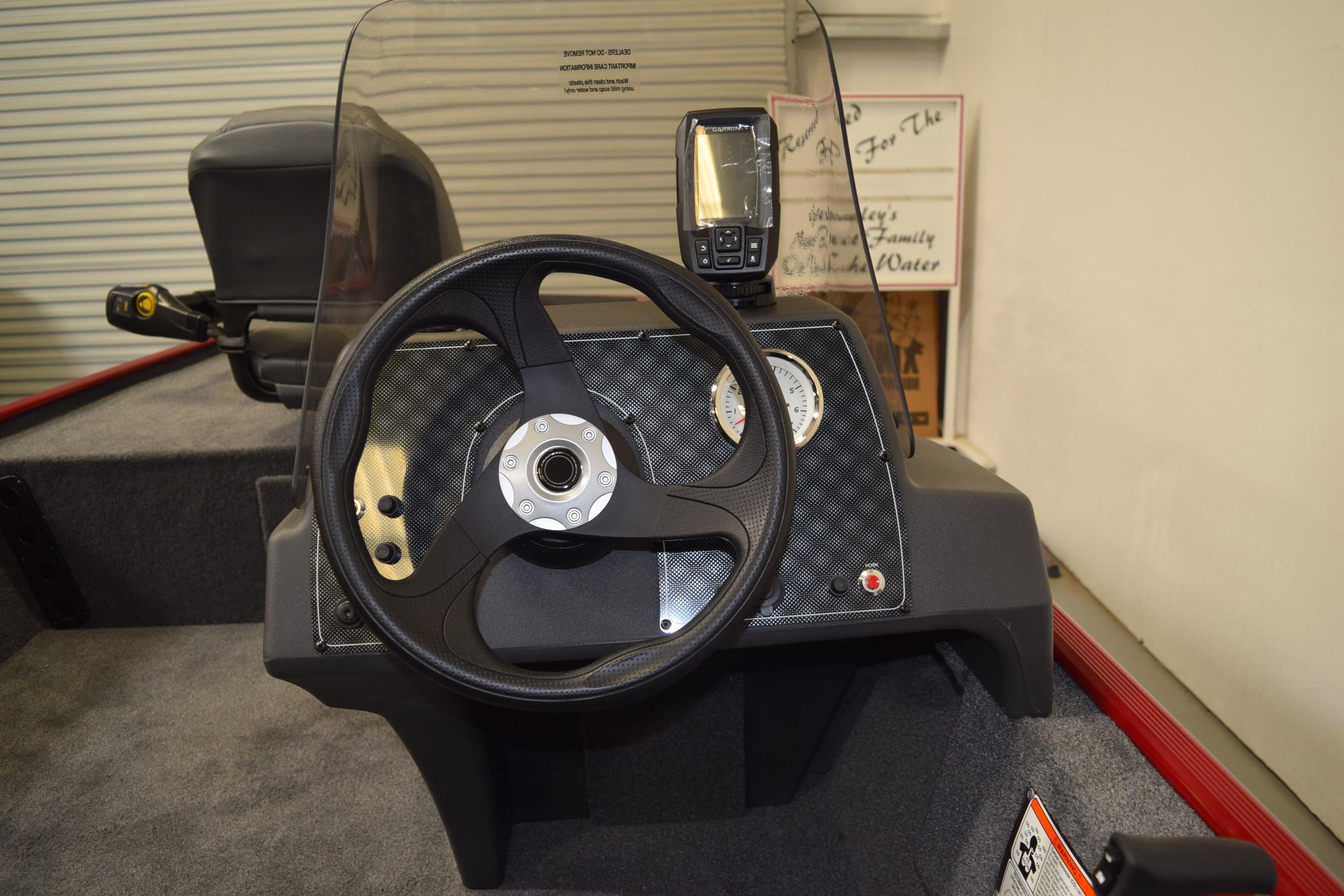 2026 Tracker Bass Tracker Classic XL boat dashboard with steering wheel and gauges.