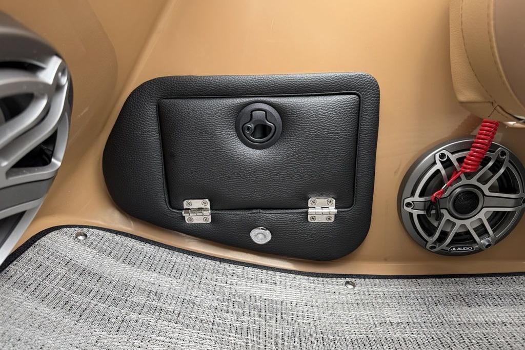 Interior of 2026 Godfrey Monaco 235 SFLC iMPACT with speaker and storage compartment.