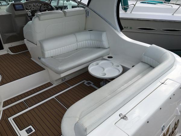 Interior of a 2004 Cruisers Yachts 3372 Express with white leather seating.
