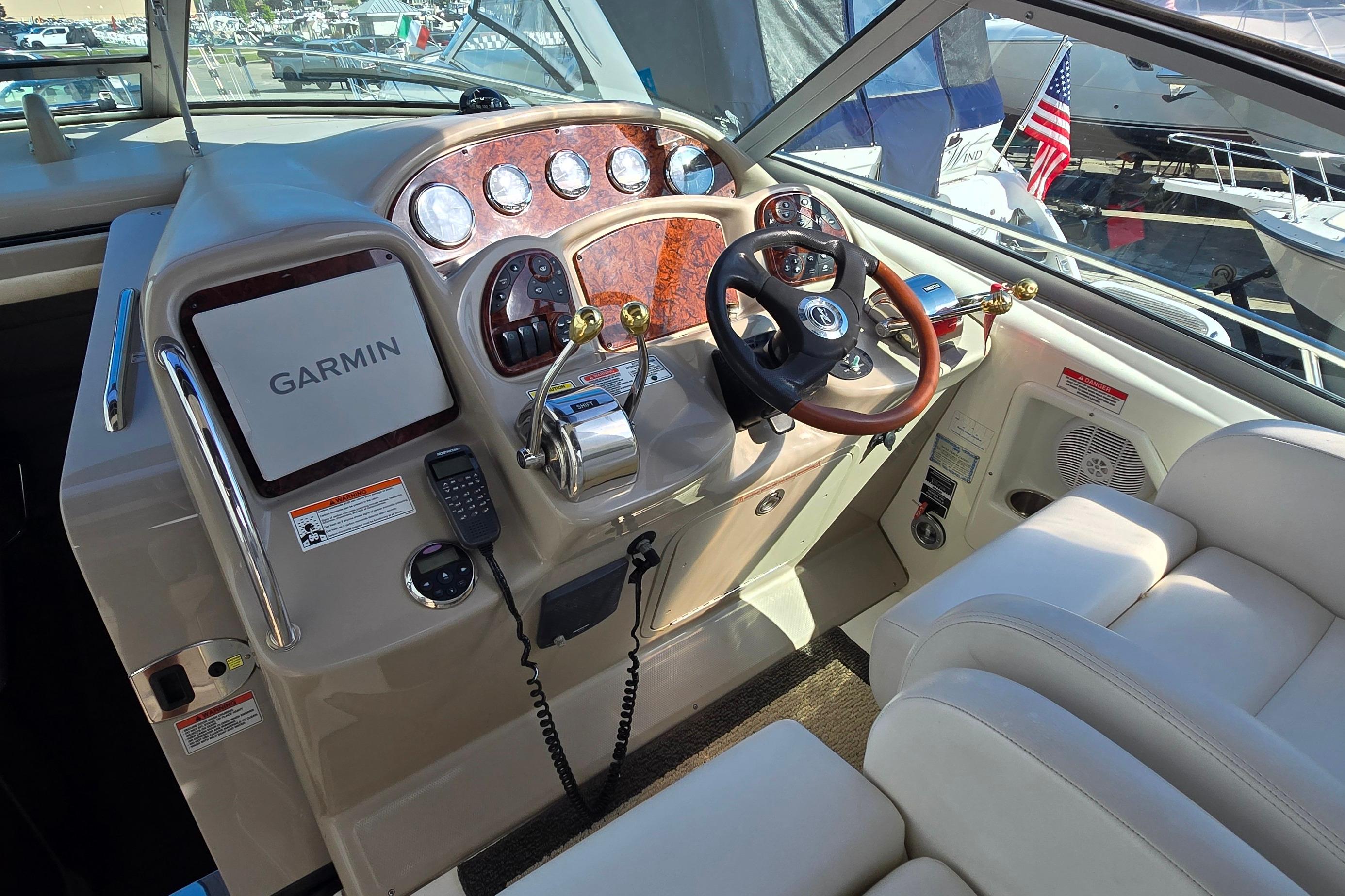 2007 Sea Ray 340 Sundancer helm with Garmin navigation and luxurious leather seating.