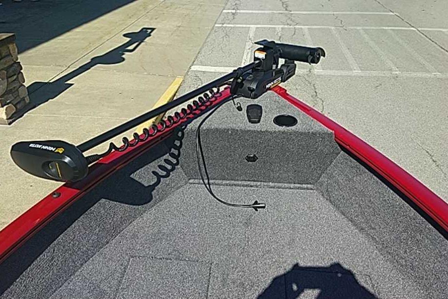 2026 Tracker Super Guide V-16 T boat with trolling motor on red deck.