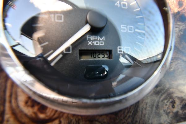 Close-up of a 1997 Sea Ray 400 Sundancer RPM gauge displaying 1029.9 RPM.