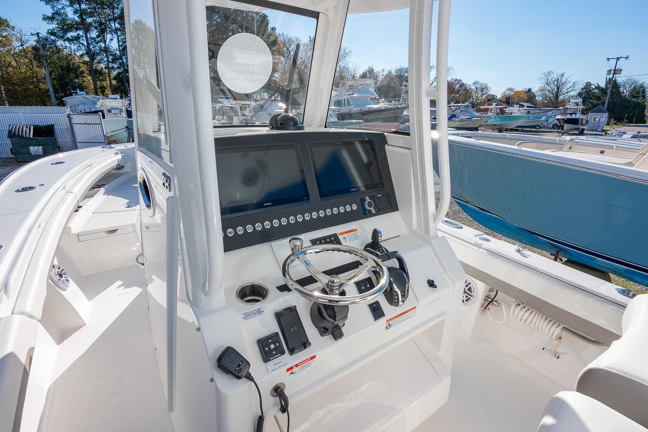 2026 Regulator 28 boat cockpit with modern steering and navigation controls.