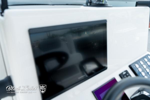 Dashboard of 2025 Caymas 281 HB boat with digital display and controls.