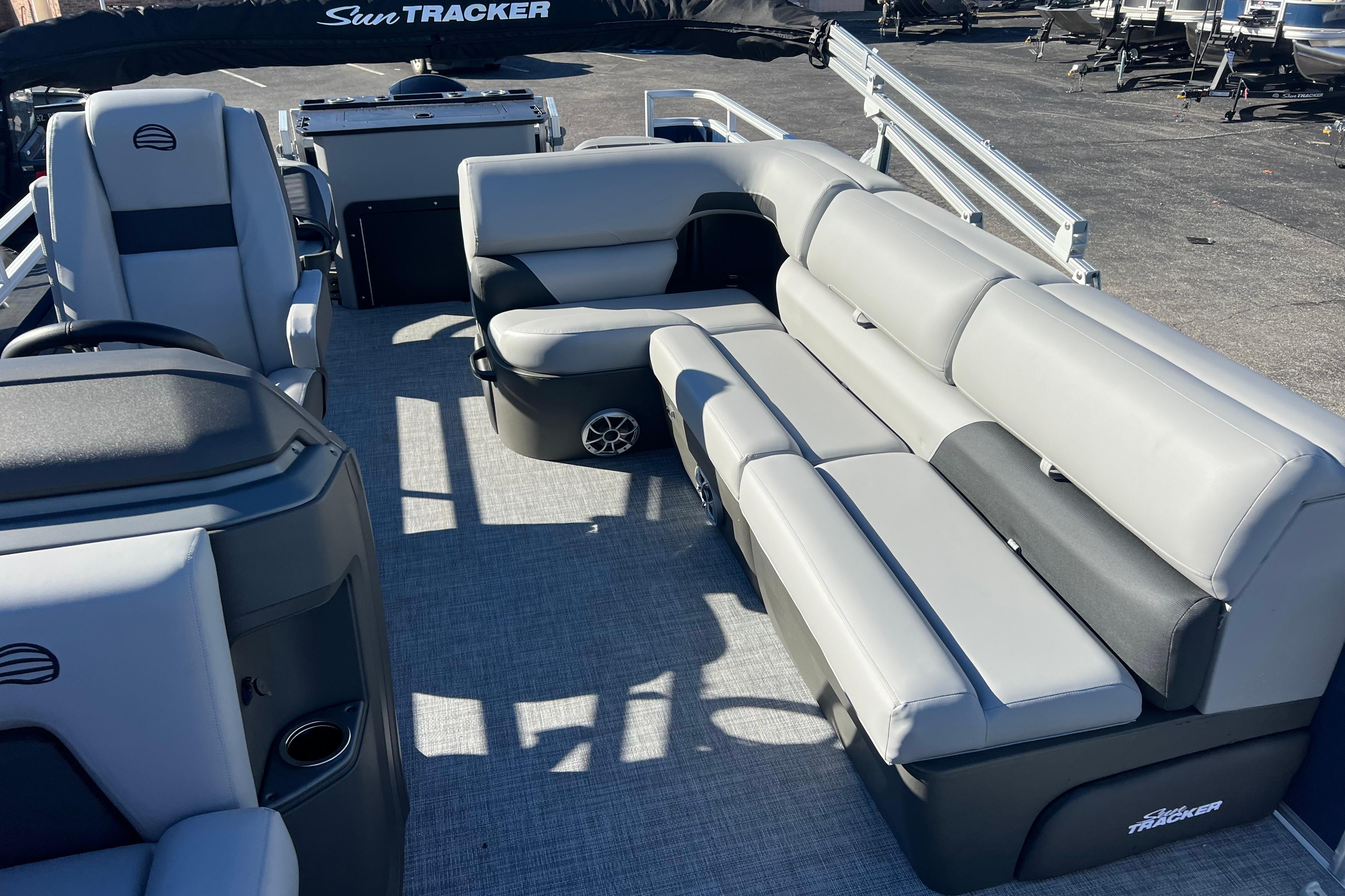 2026 Sun Tracker Sportfish 24 XP3 pontoon boat interior with gray seating and modern design.